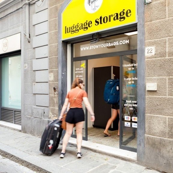 Storefront of a luggage storage company in Florence, Italy.