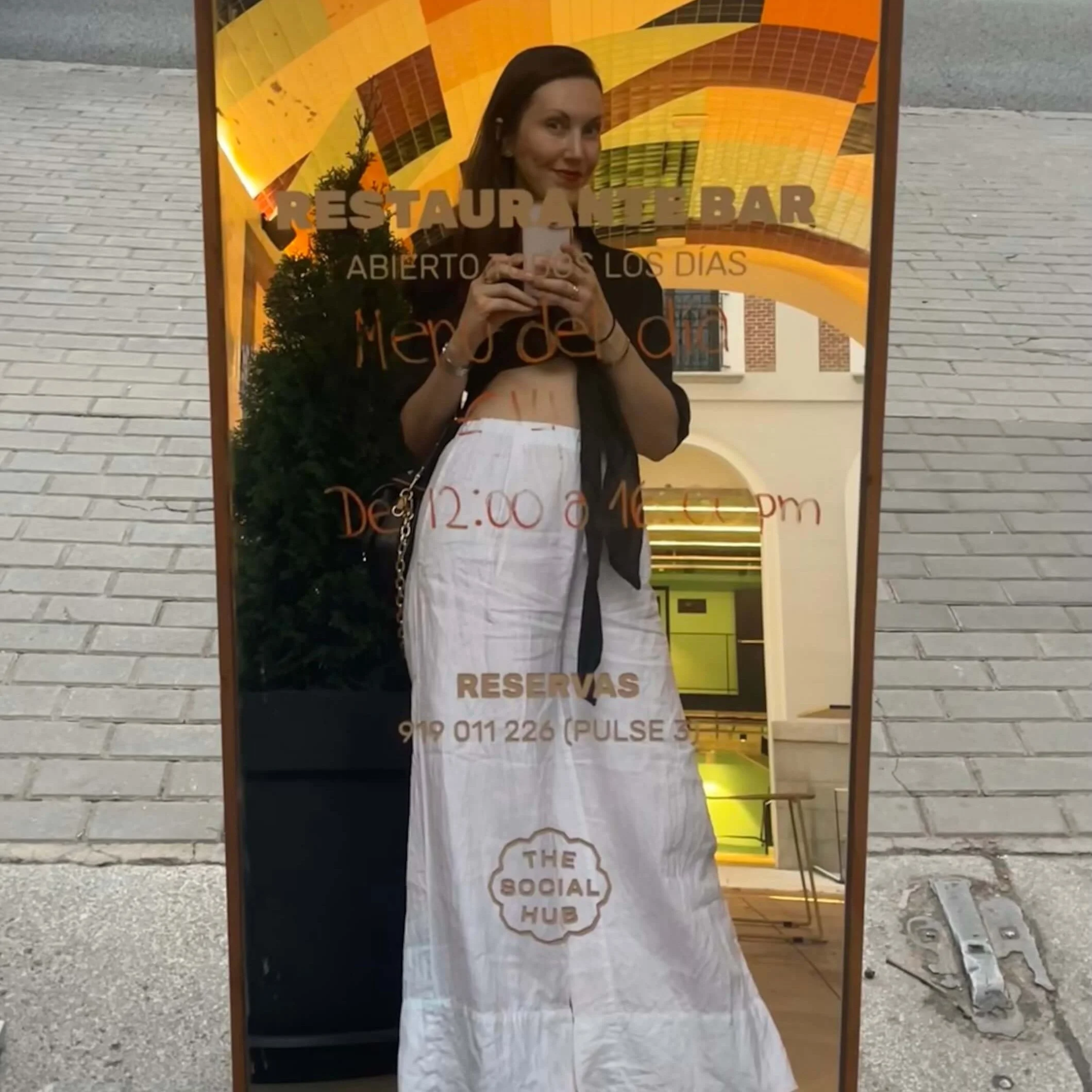 The writer takes a selfie in a mirror at the Social Hub in Madrid.