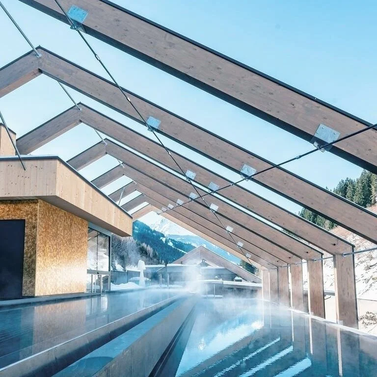 The outdoor pool at Zillergrund Rock Luxury Mountain Resort in Mayrhofen, Austria.