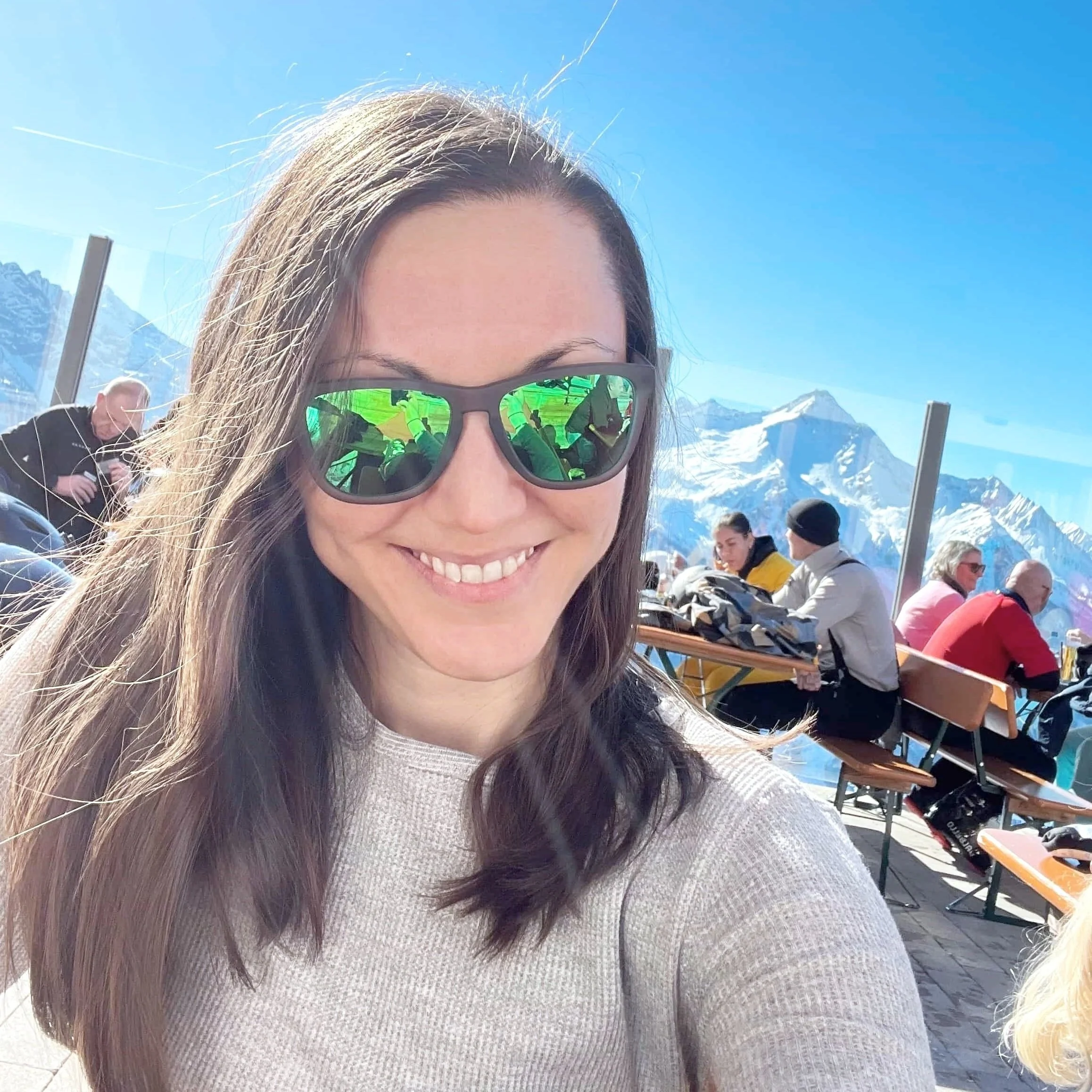 A beginner skier smiles after skiing easy blue runs in Mayrhofen, Austria.