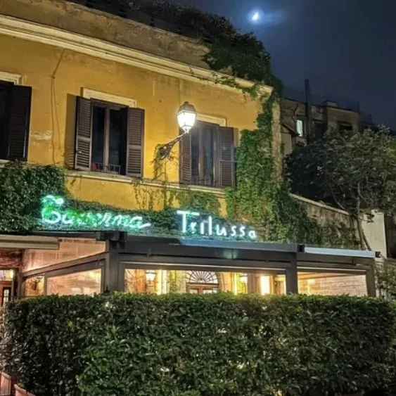 The exterior of Taverna Trilussa on an evening in Rome.