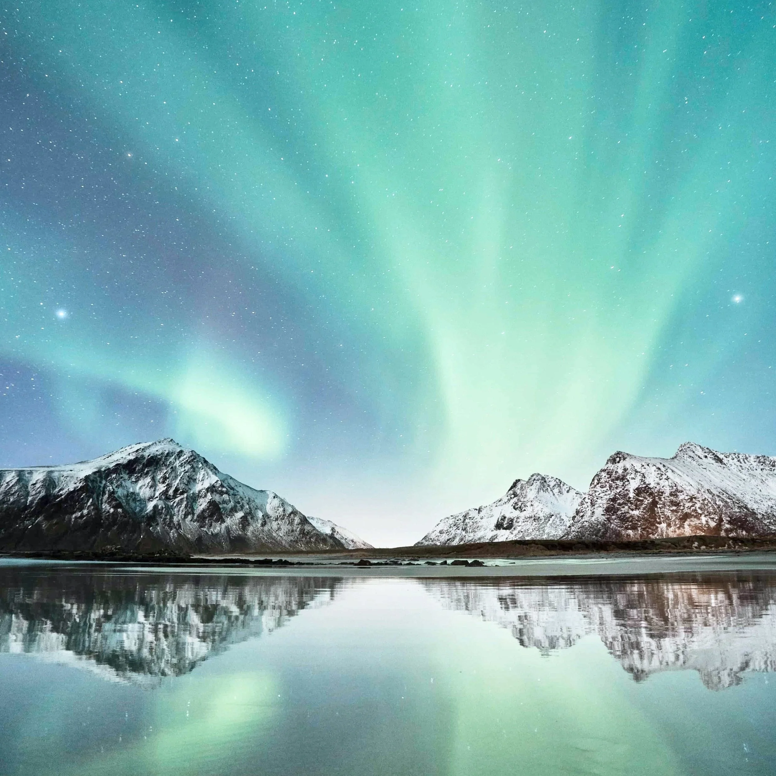 The northern lights in blue and green in Norway.