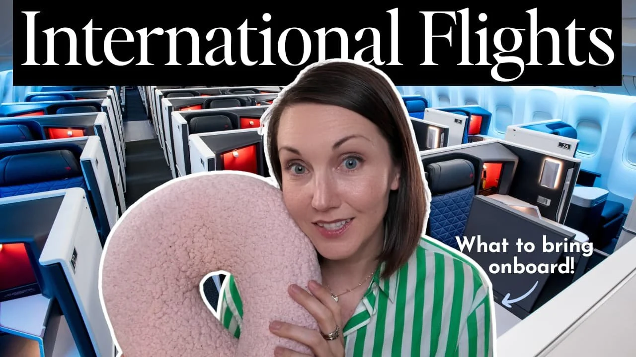 The author holding a neck pillow in a plane.