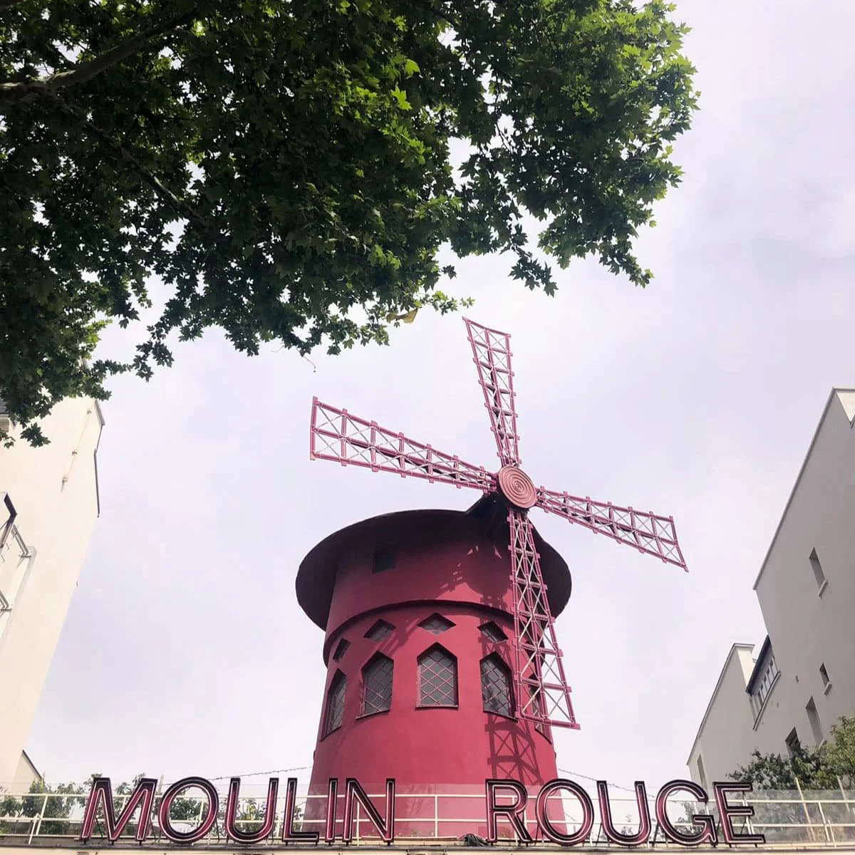 The iconic red windmill at Moulin Rouge.