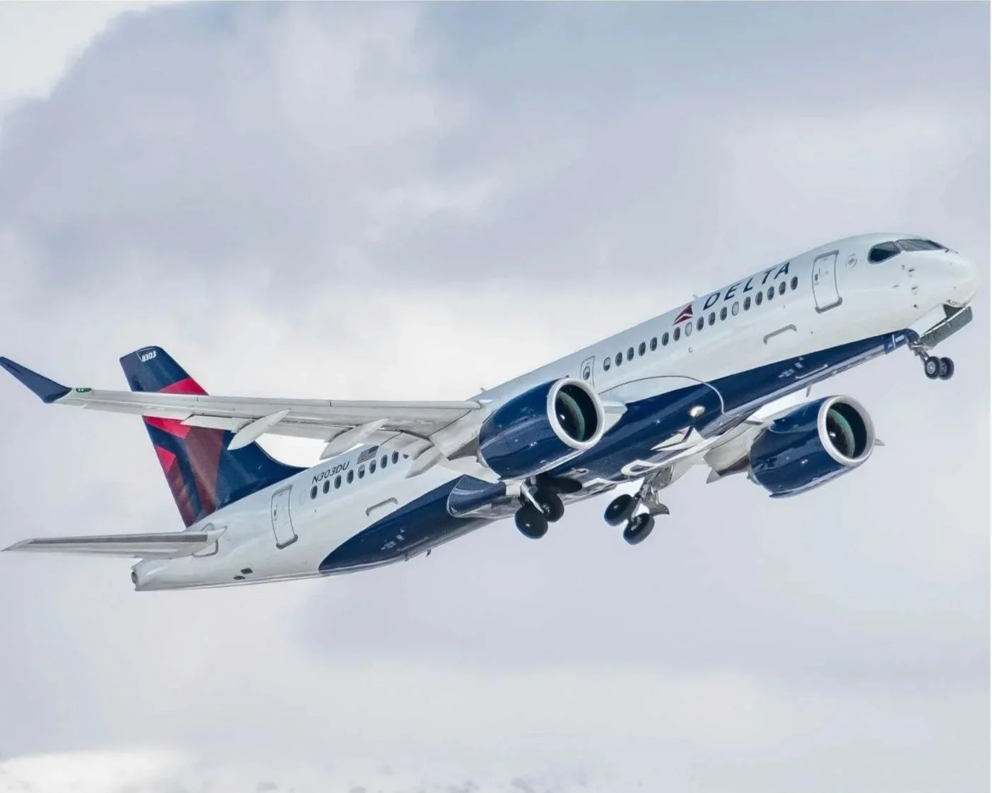 A Delta Airlines plane in the air.