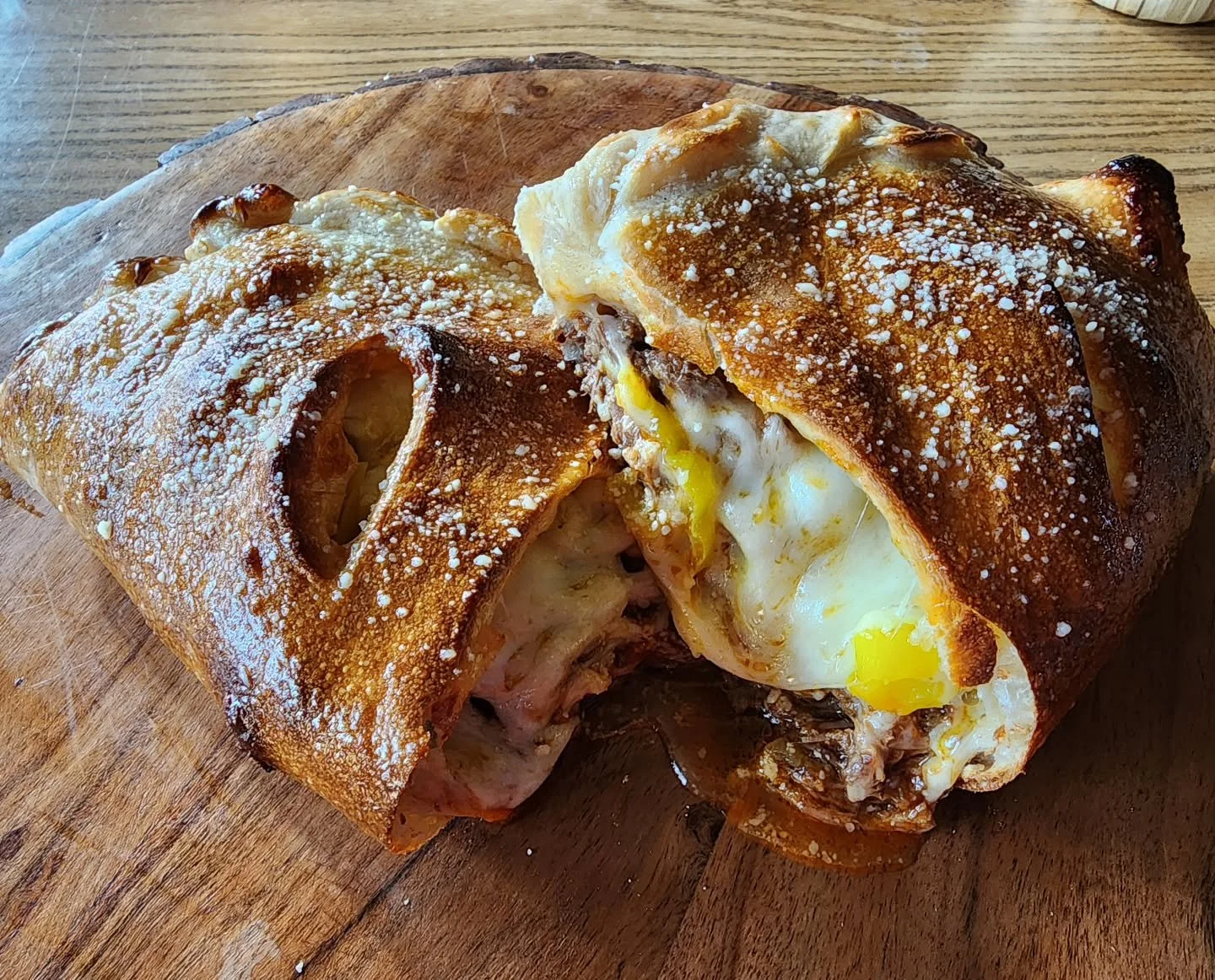 Italian Pot Roast Calzone tonight!! Pork butt and chuck roast, braised with all the herbs and veggies in a beefy tomato sauce. Packed into the calz9ne dough with mozzarella and banana peppers. Running it til it's 86ed.

#vicsoven #potroast #hometownp