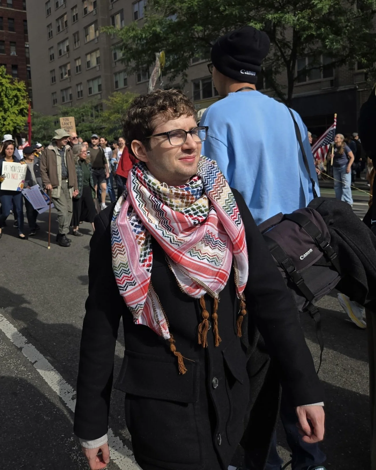 Josh Arnon marching at a protest.