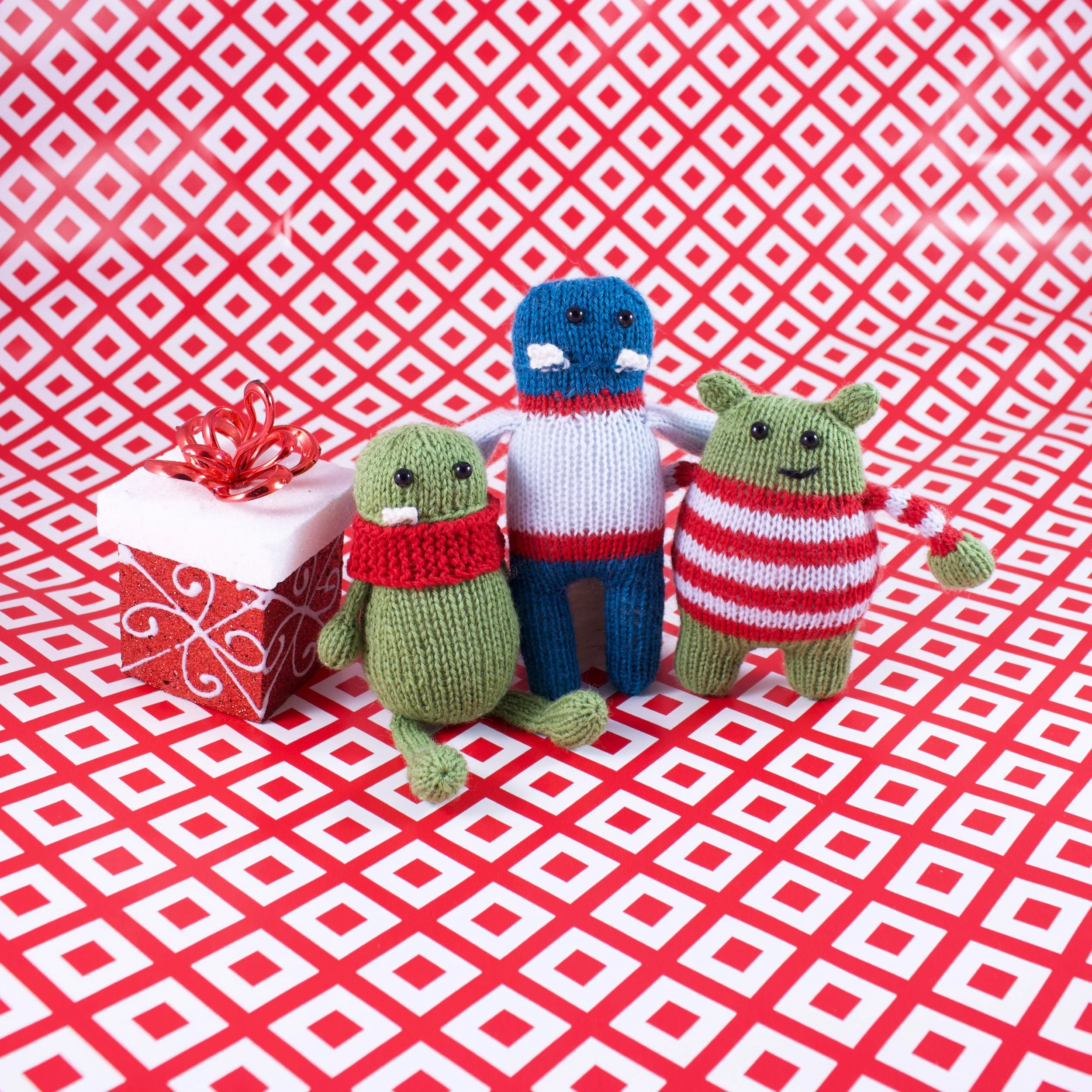 Christmas Monster Ornament Trio All 3 On Paper With Present.jpg