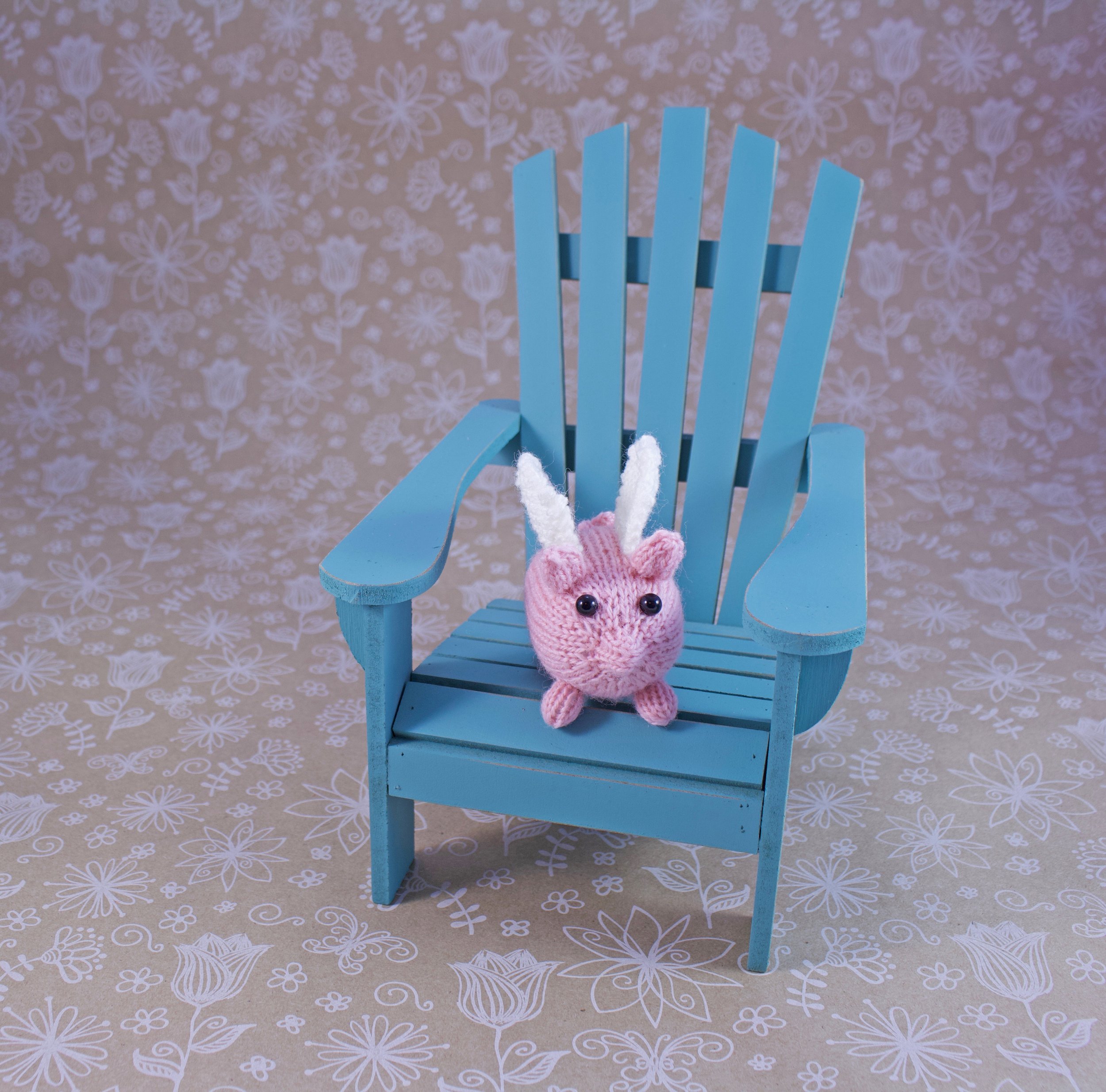 KnittedPigWithWingsInChair.jpg
