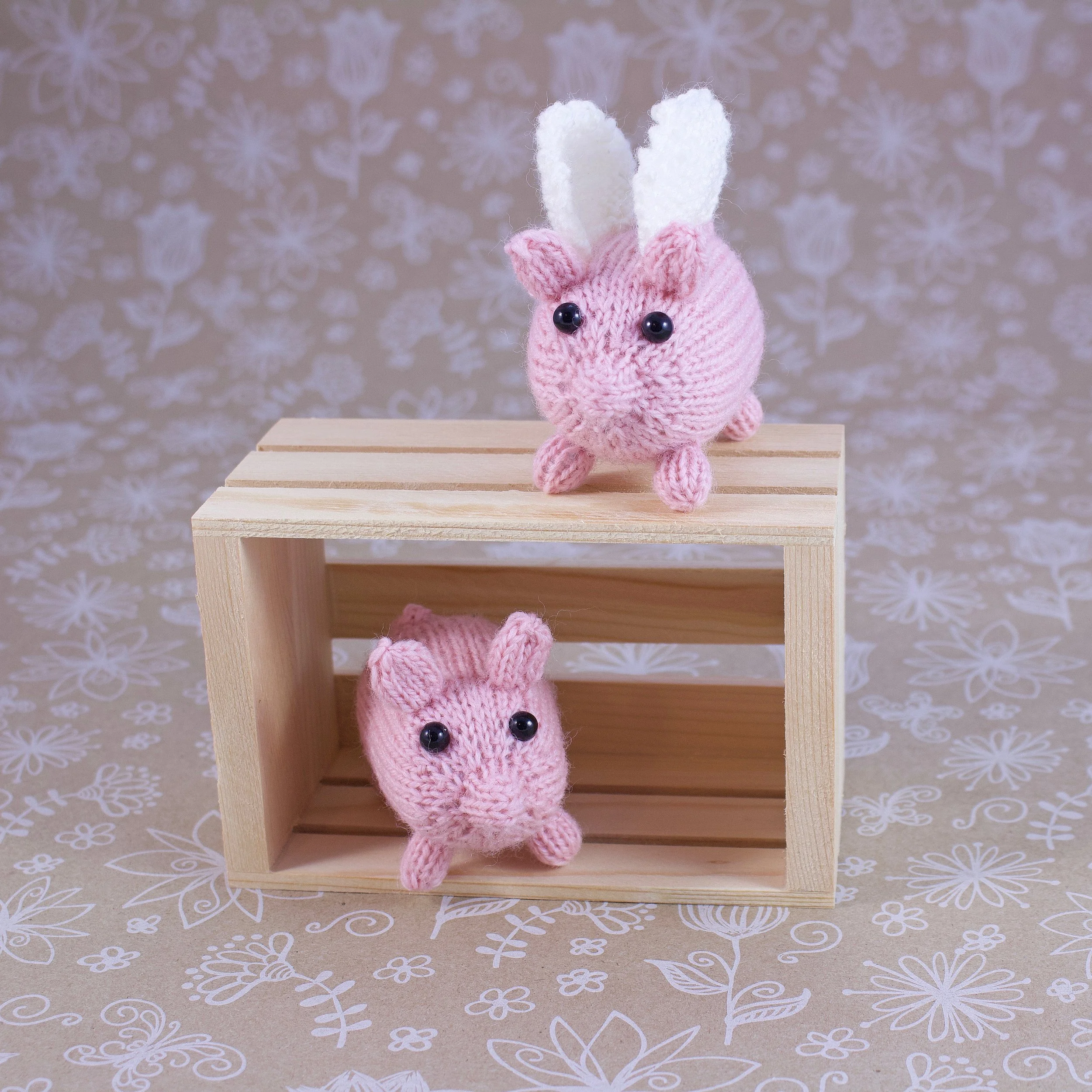 KnittedPigWithandWithoutWingsonCrate.jpg