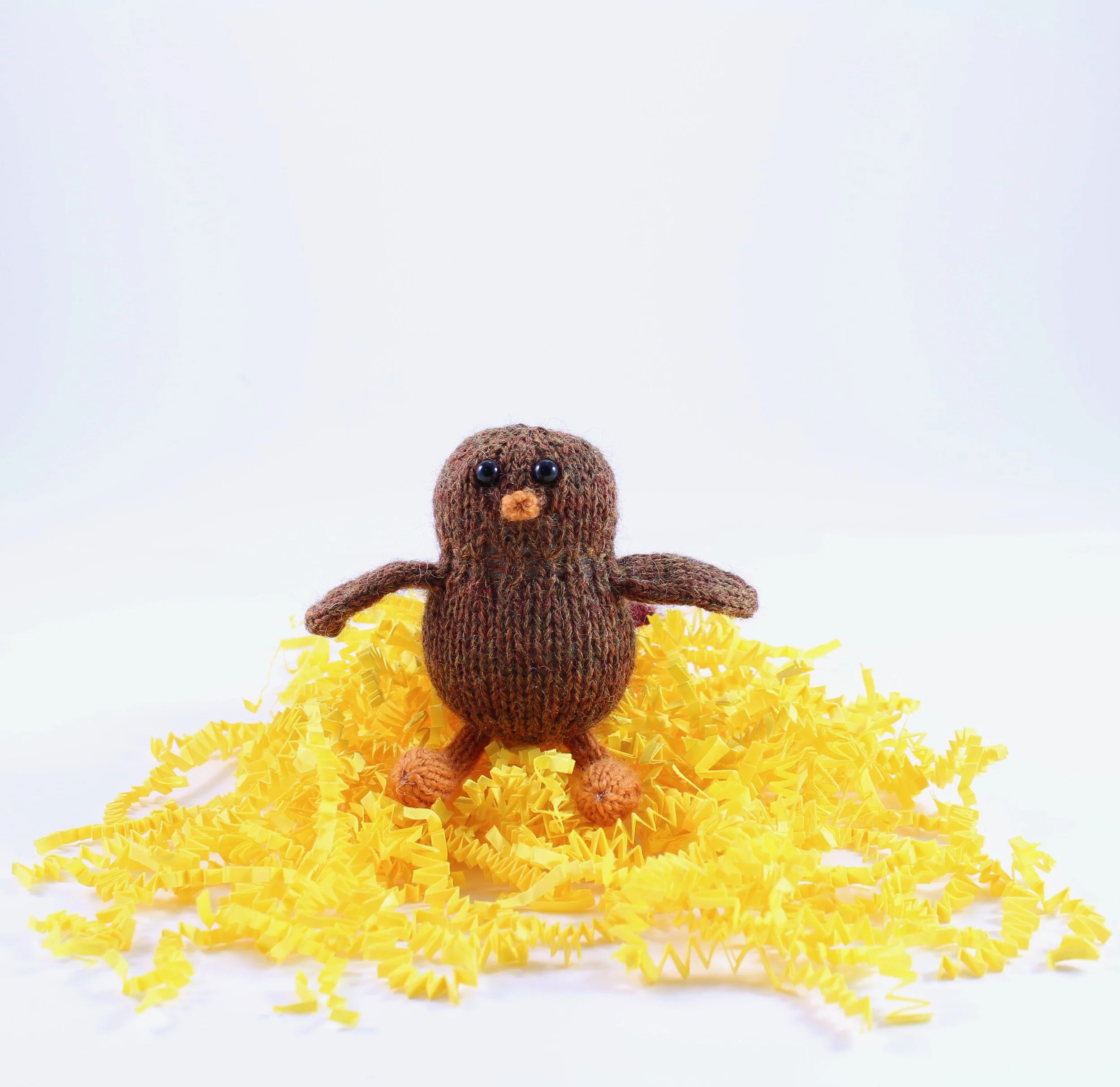 KnittedPocketTurkeyOnYellowPaper.jpg