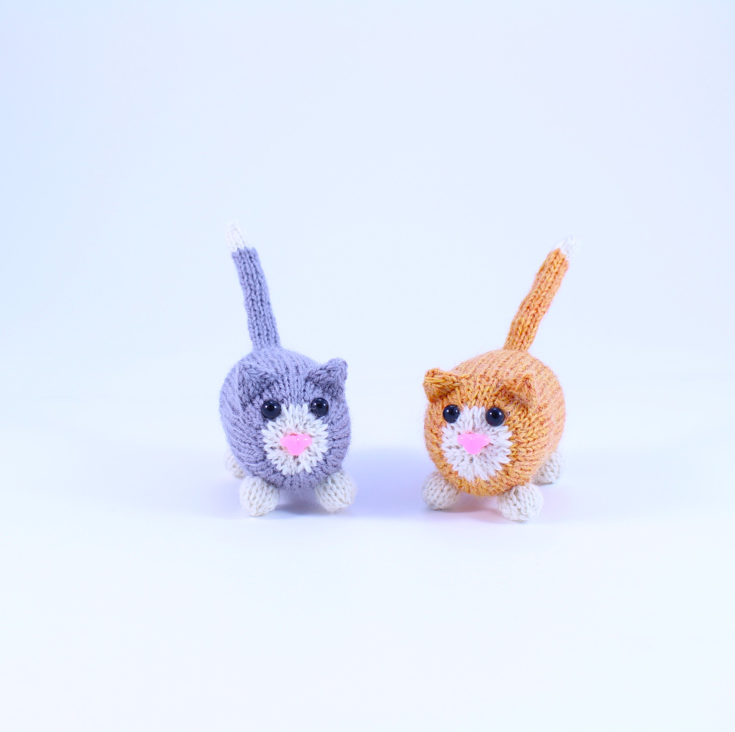 2KnittedPocketCatsOnWhite.jpg