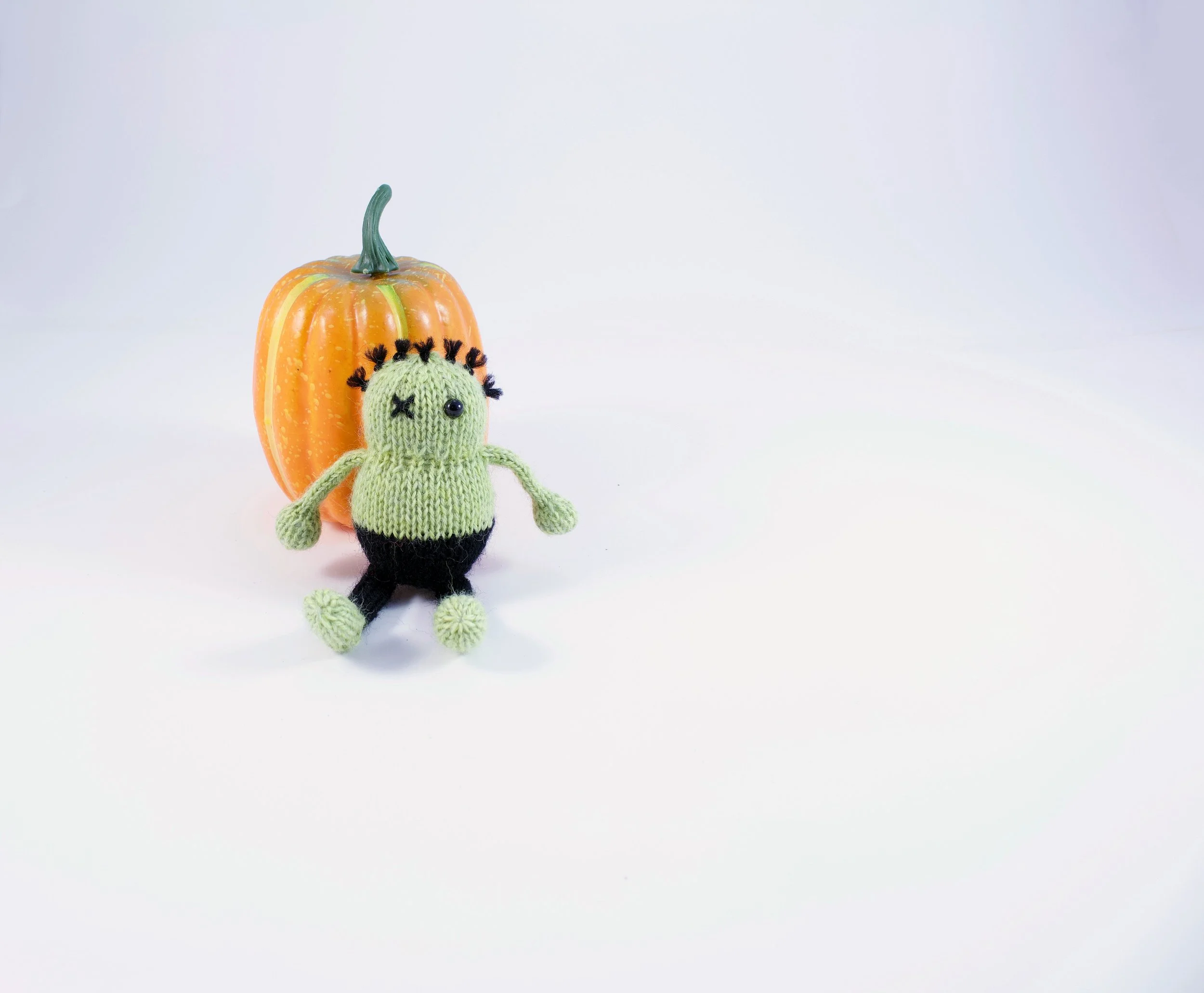 KnittedPocketZombieWithPumpkin.jpg