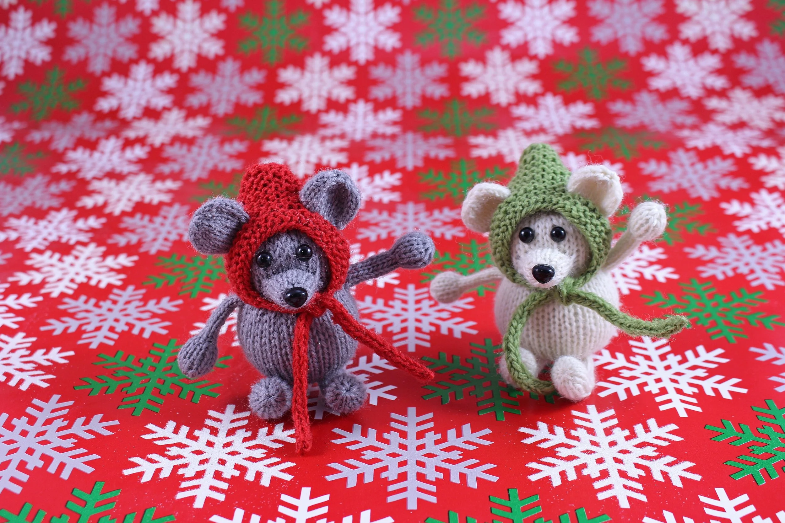 WickedlyMerryMouseKnittedChristmasOrnamentOnRedWrappingPaper.jpg