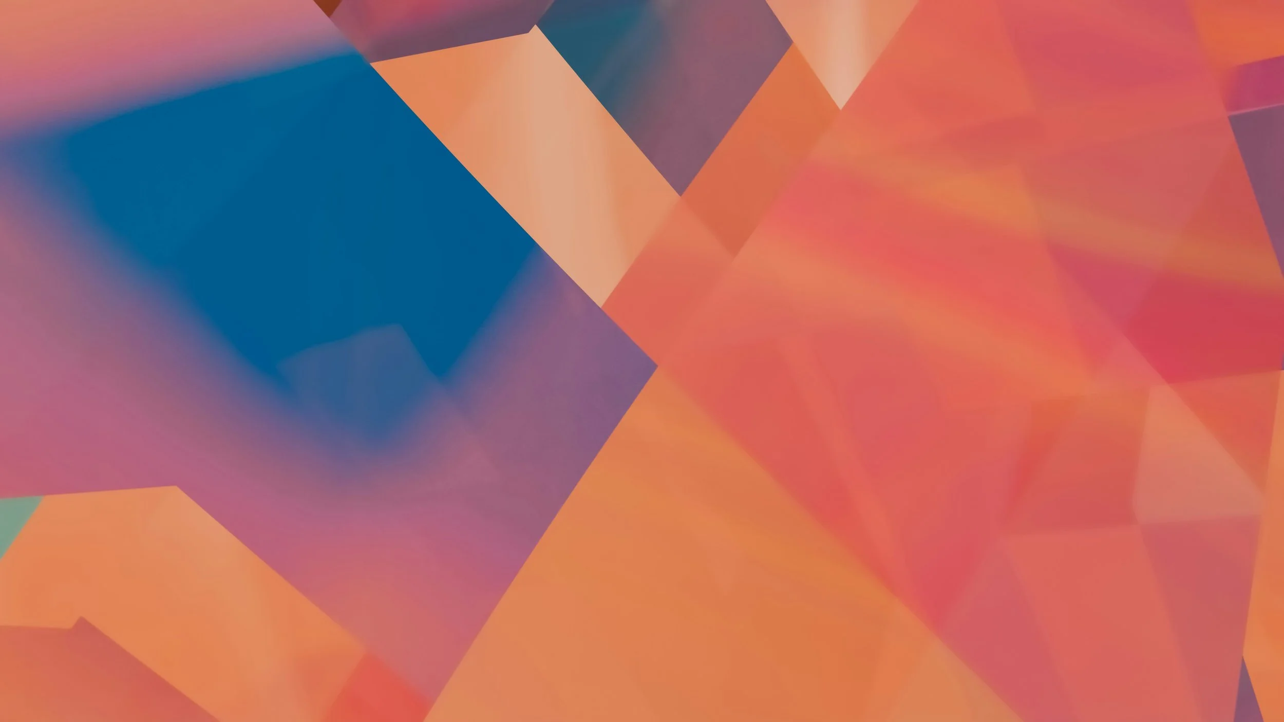 Abstract digital art with geometric shapes and vibrant gradient colors, including blue, orange, red, and purple.