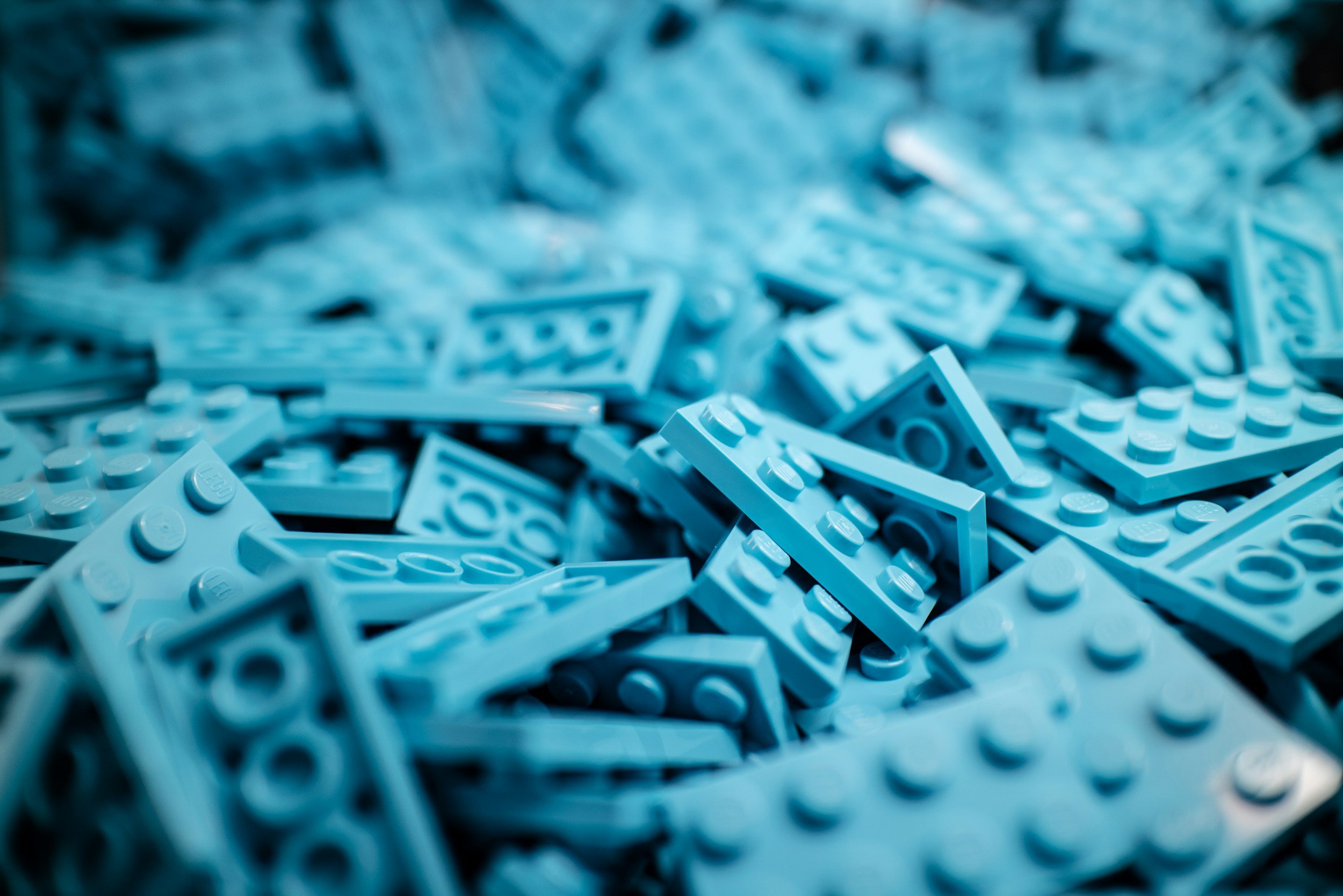 Close-up of light blue LEGO bricks scattered randomly.