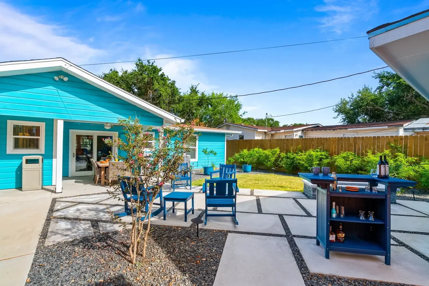 Patio lounge area with an outdoor bar cart at The Oasis Corpus Christi