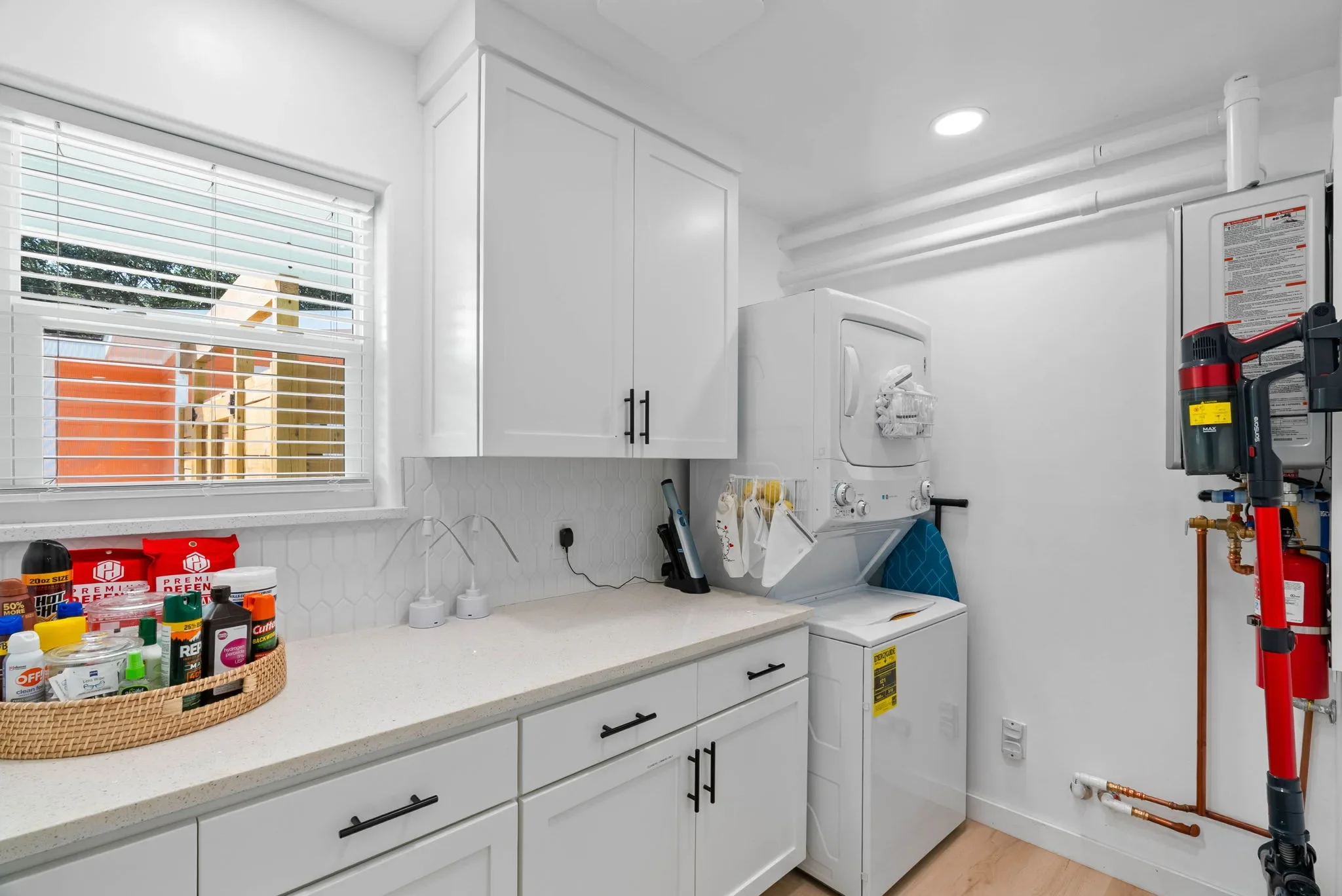 Laundry room with a guest snack station on the counter at The Oasis