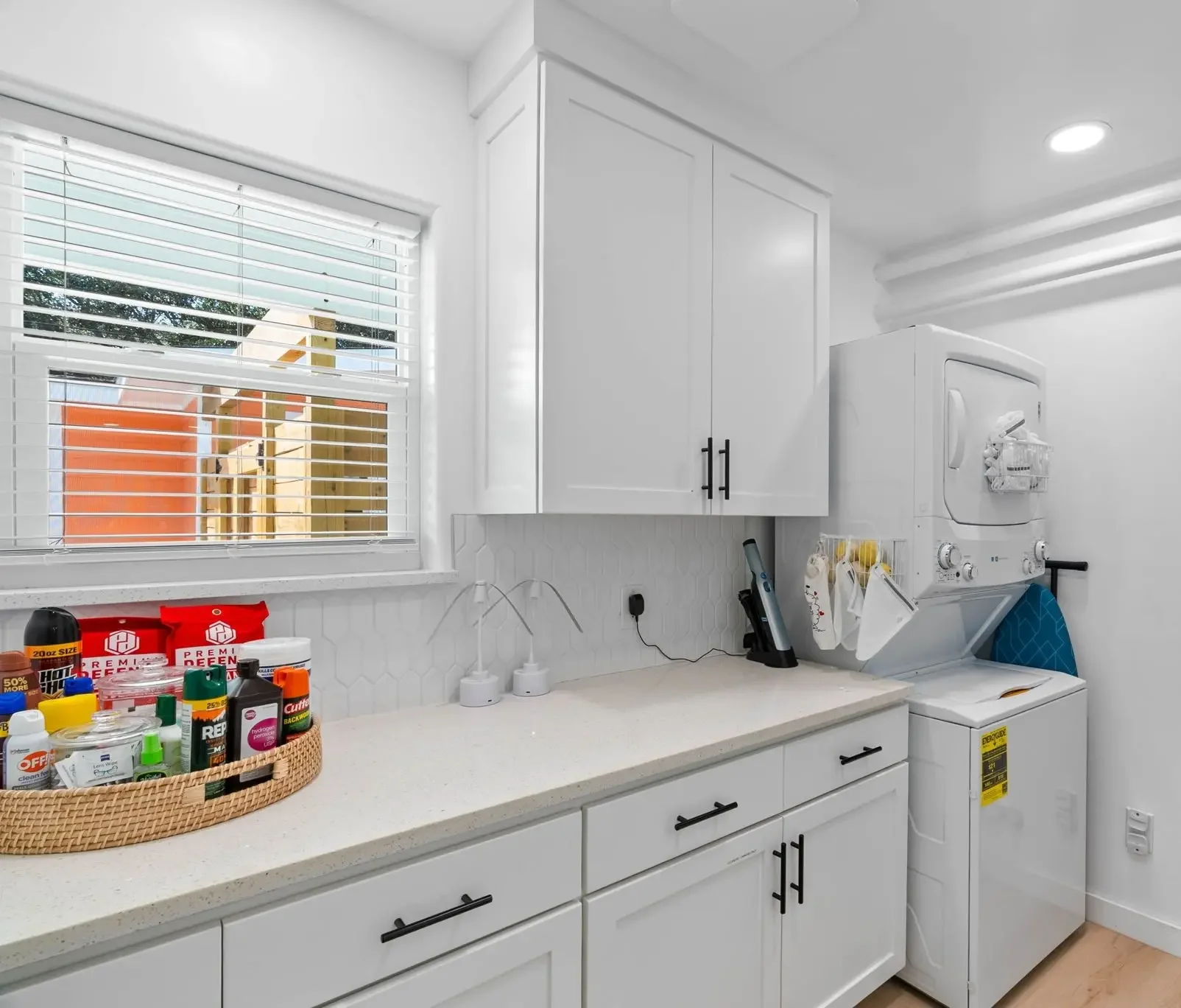Laundry room with a guest snack station on the counter at The Oasis