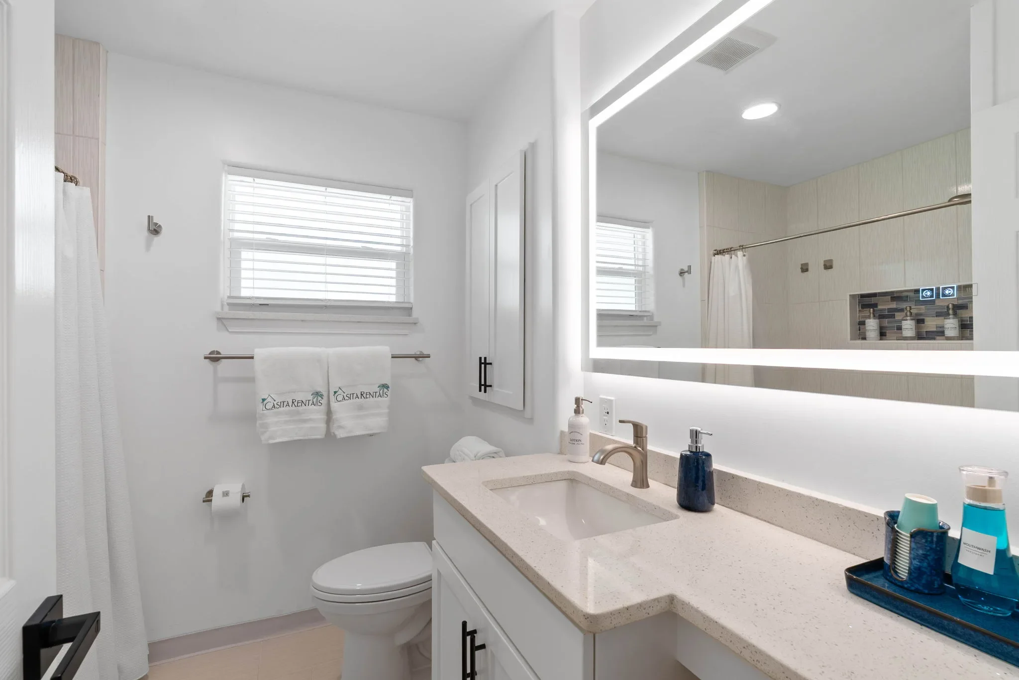 Guest bathroom with walk-in shower at this 3-bedroom Corpus Christi rental