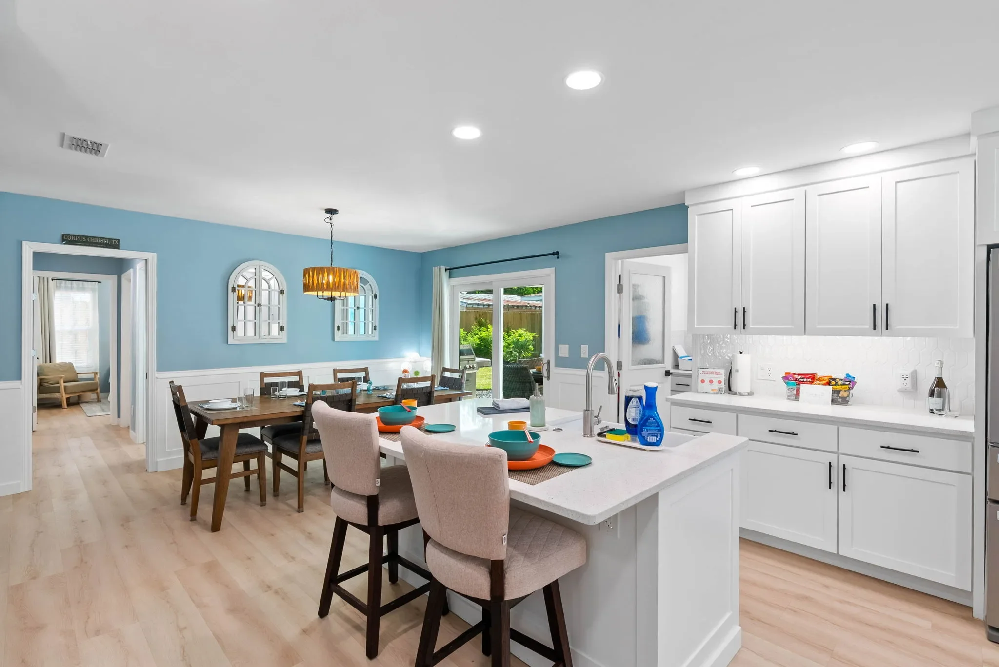 Kitchen and dining combo with pendant lighting at The Oasis vacation rental