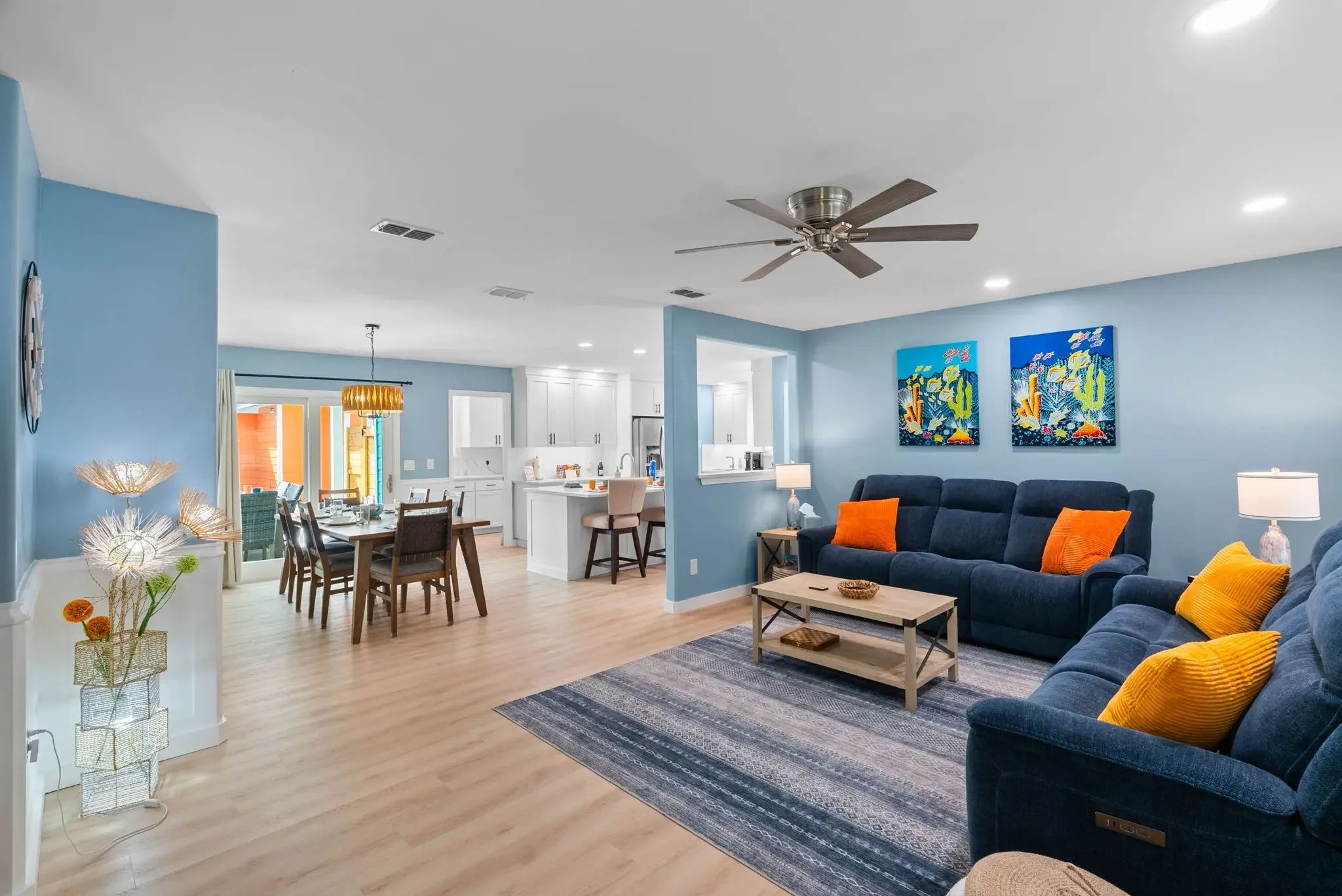 Open-concept living, dining, and kitchen area inside The Oasis vacation rental