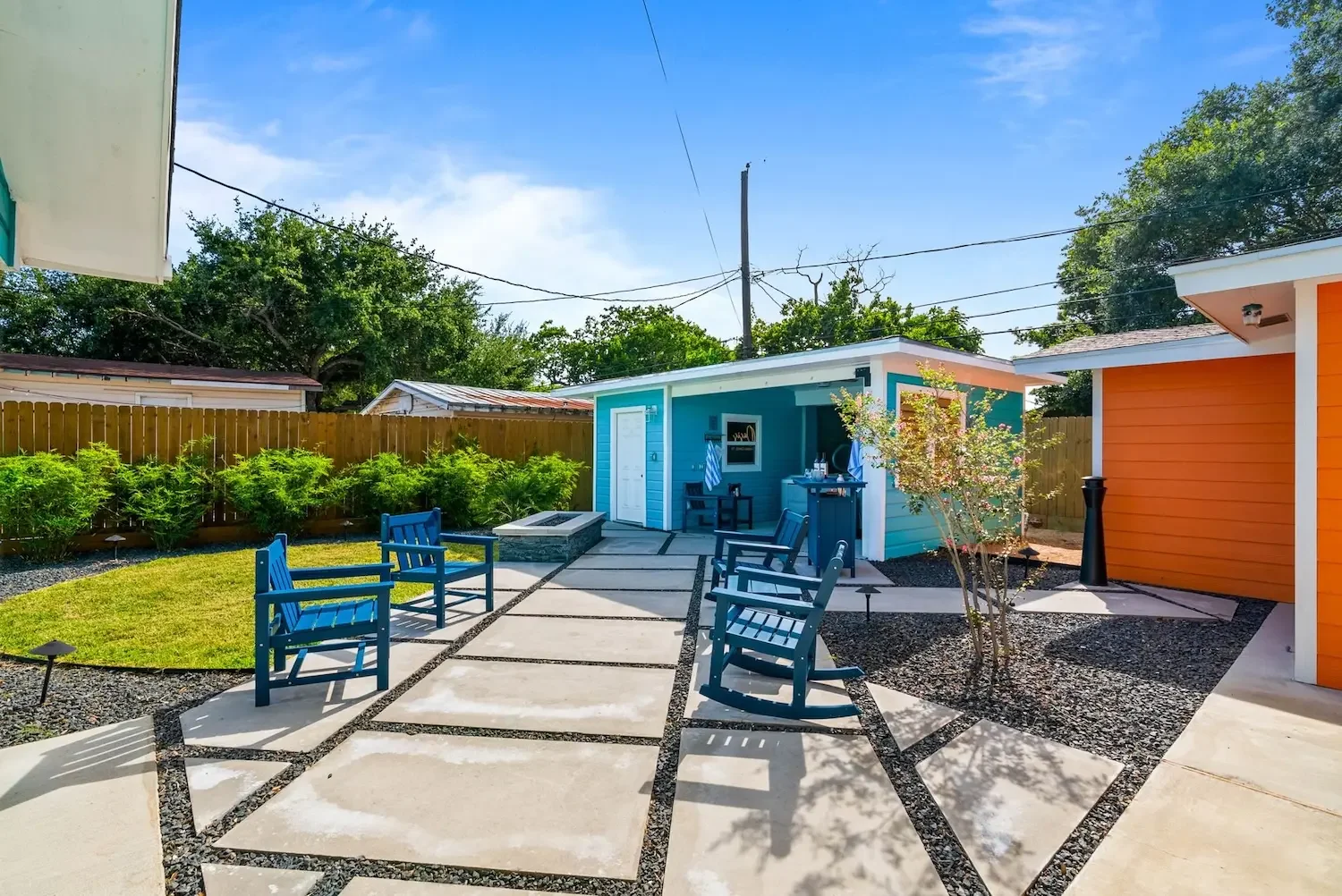 Backyard lounge seating with gravel landscaping at The Oasis vacation rental