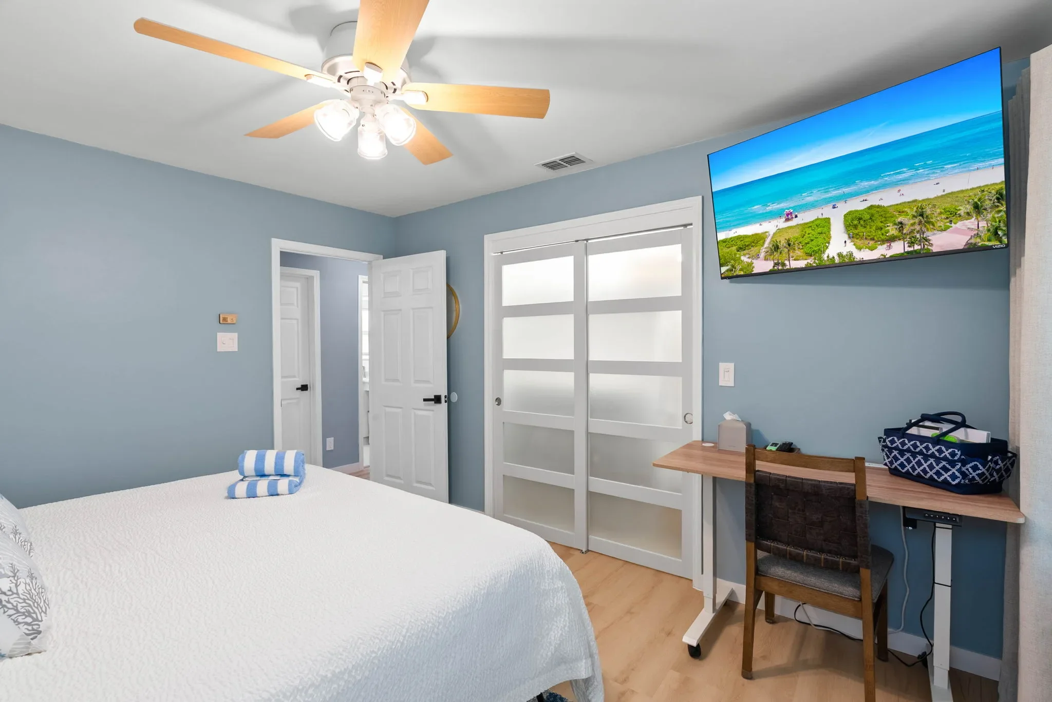 Primary king bedroom with a standing desk nook by the window