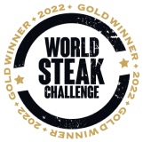 Logotipo del Desafío Mundial de Bistec, con texto en negro y dorado, destacando el premio de oro del 2022.