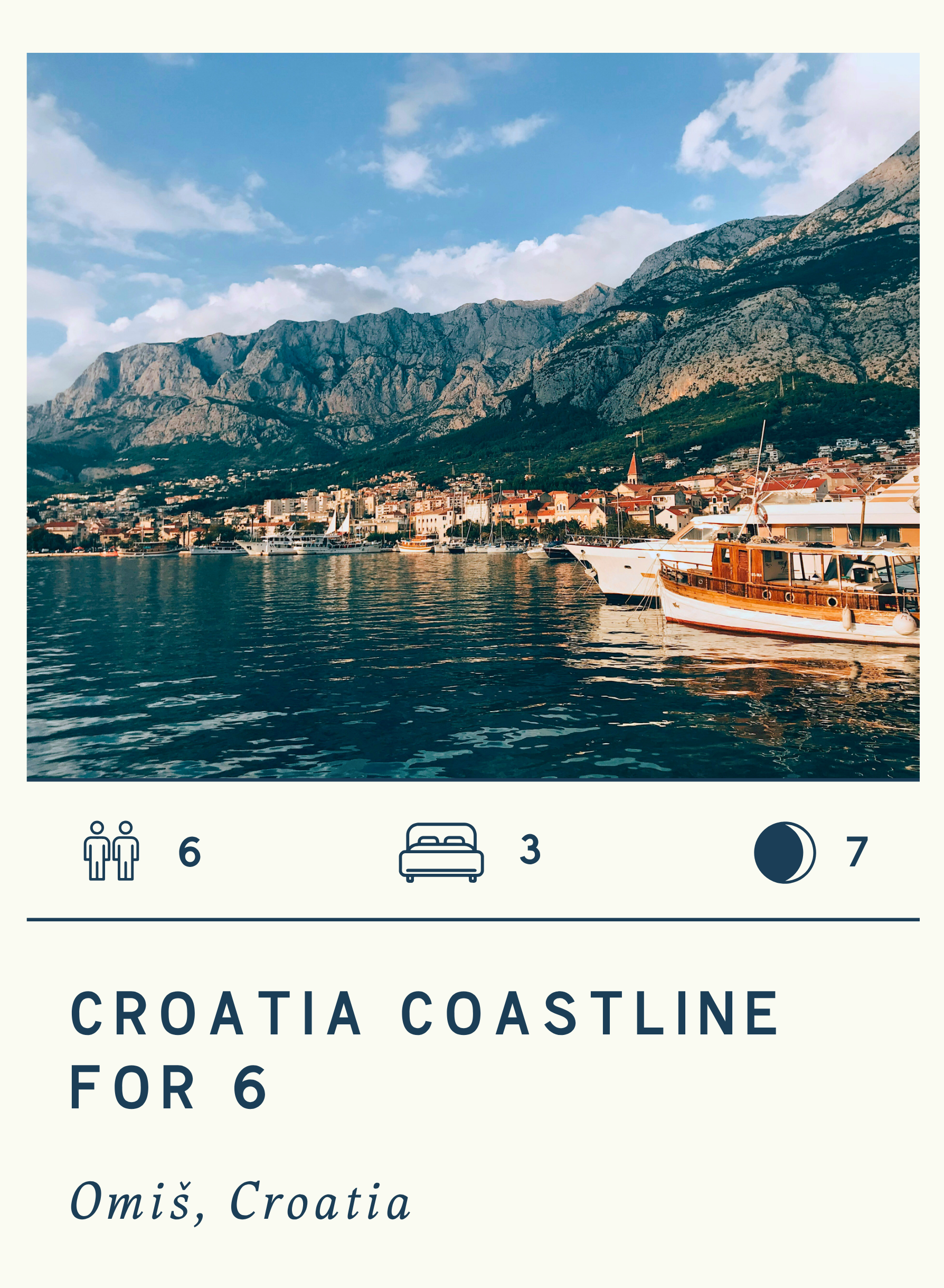 View of the town of Omiš, Croatia, with boats docked at the harbor and mountains in the background.