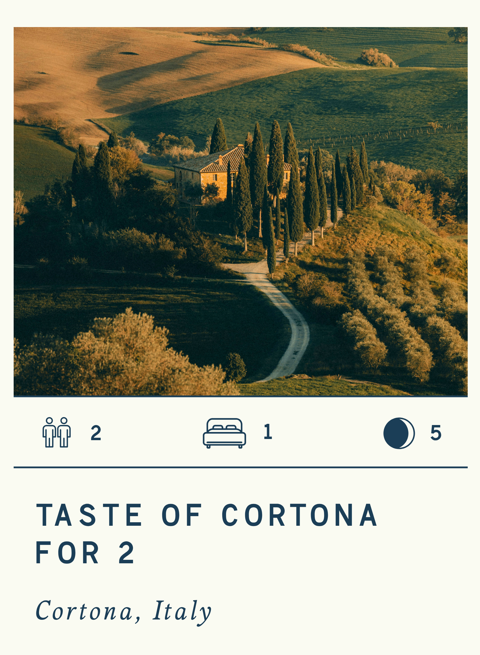 Landscape of rolling hills in Cortona, Italy with a winding road leading to a building surrounded by tall cypress trees.