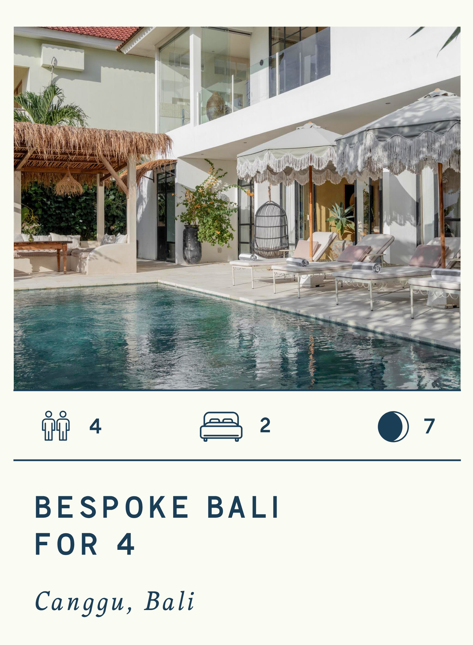 Photo of a modern hotel or resort with a swimming pool, sun loungers with umbrellas, and a shaded seating area under a thatched roof, in Bali, Indonesia.