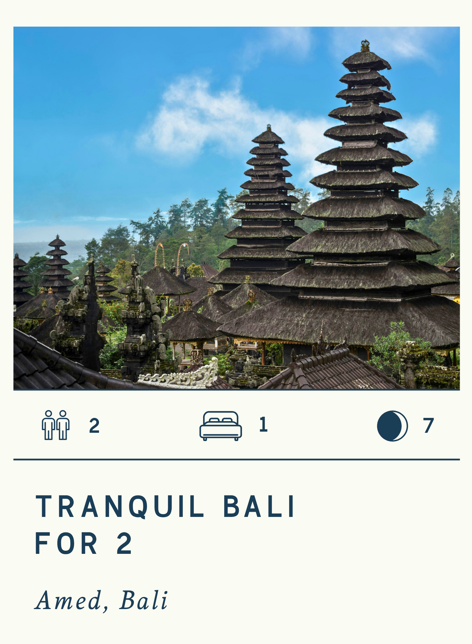 Photo of traditional Balinese pagoda-style structures with thatched roofs in Bali, with blue sky and trees in the background.