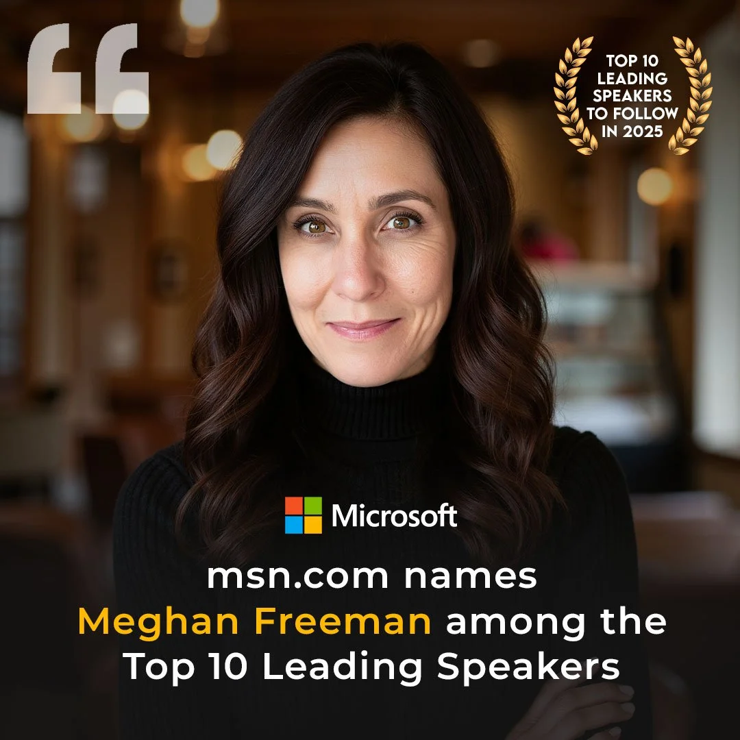 Portrait of Meghan Freeman with dark hair, wearing a black turtleneck, smiling, in a warm indoor setting, announcing she's among the top 10 leading speakers for msn.com in 2025.