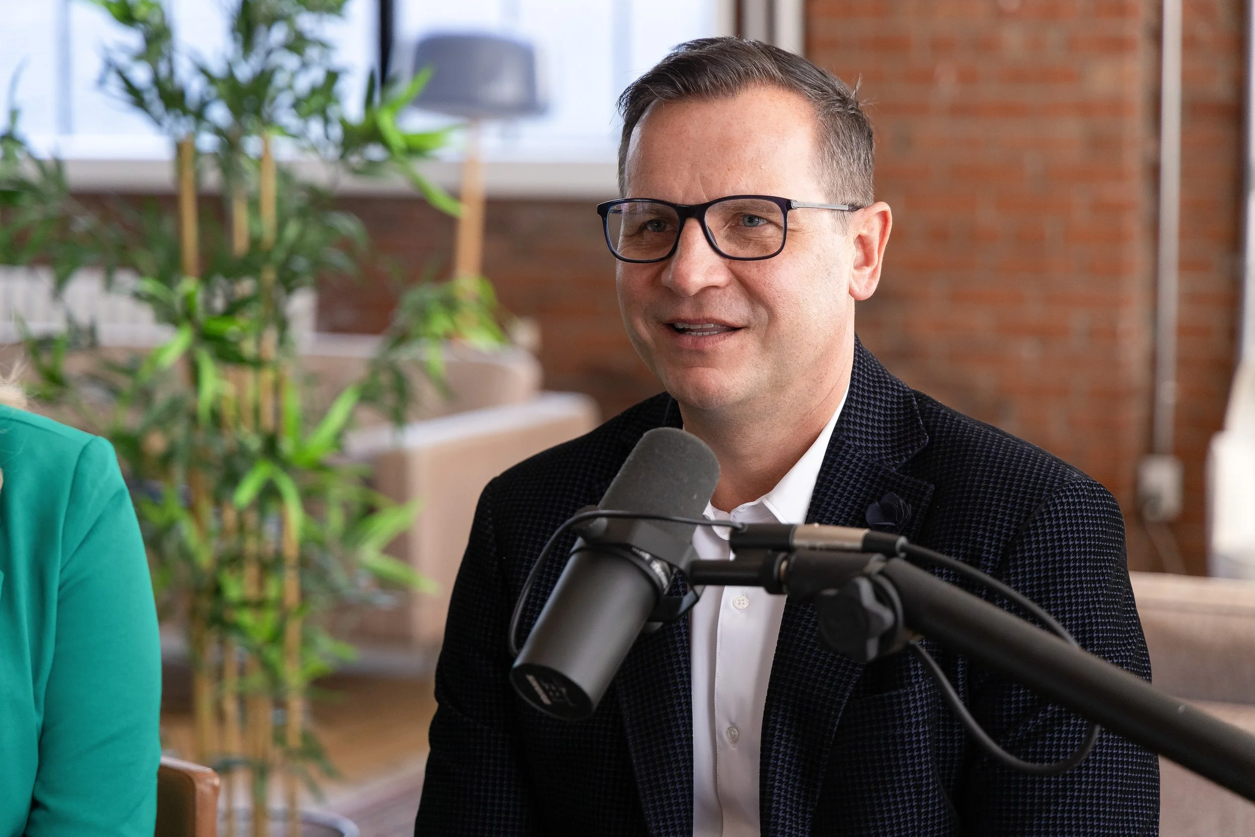 Businessman on podcast produced on location in his office