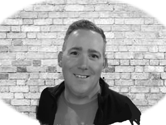 Black and white portrait of Ryan Chmielewski smiling.