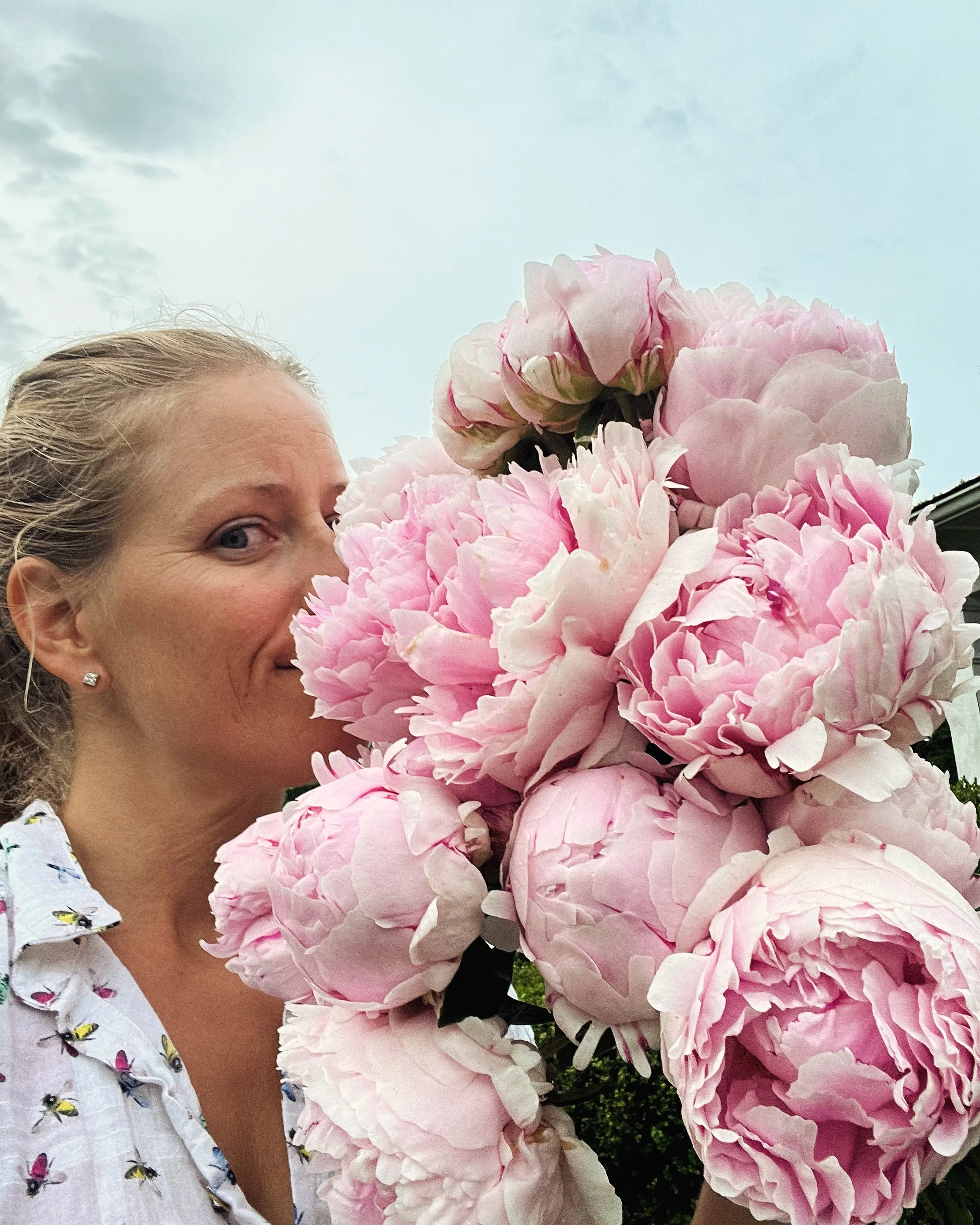 Erin Smelling Peonies.JPG