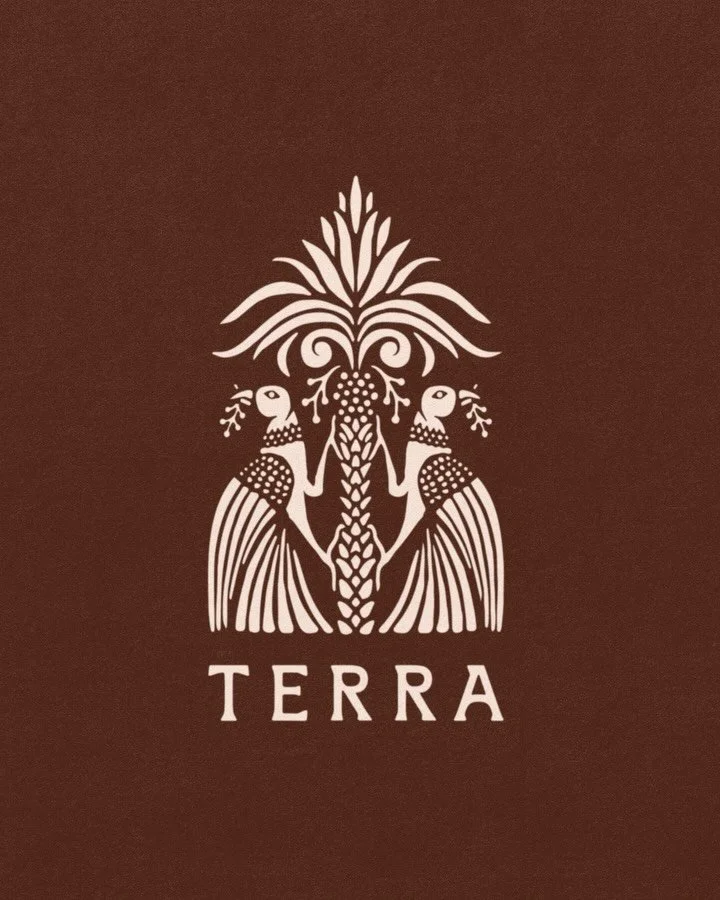 Every symbol begins with raw sketches and observation. 

For Terra, I studied the forms, rhythms, and symbolism of the desert landscape and the rituals of wellness.

Two birds rise around a palm, forming a protective canopy and a mark that speaks to 