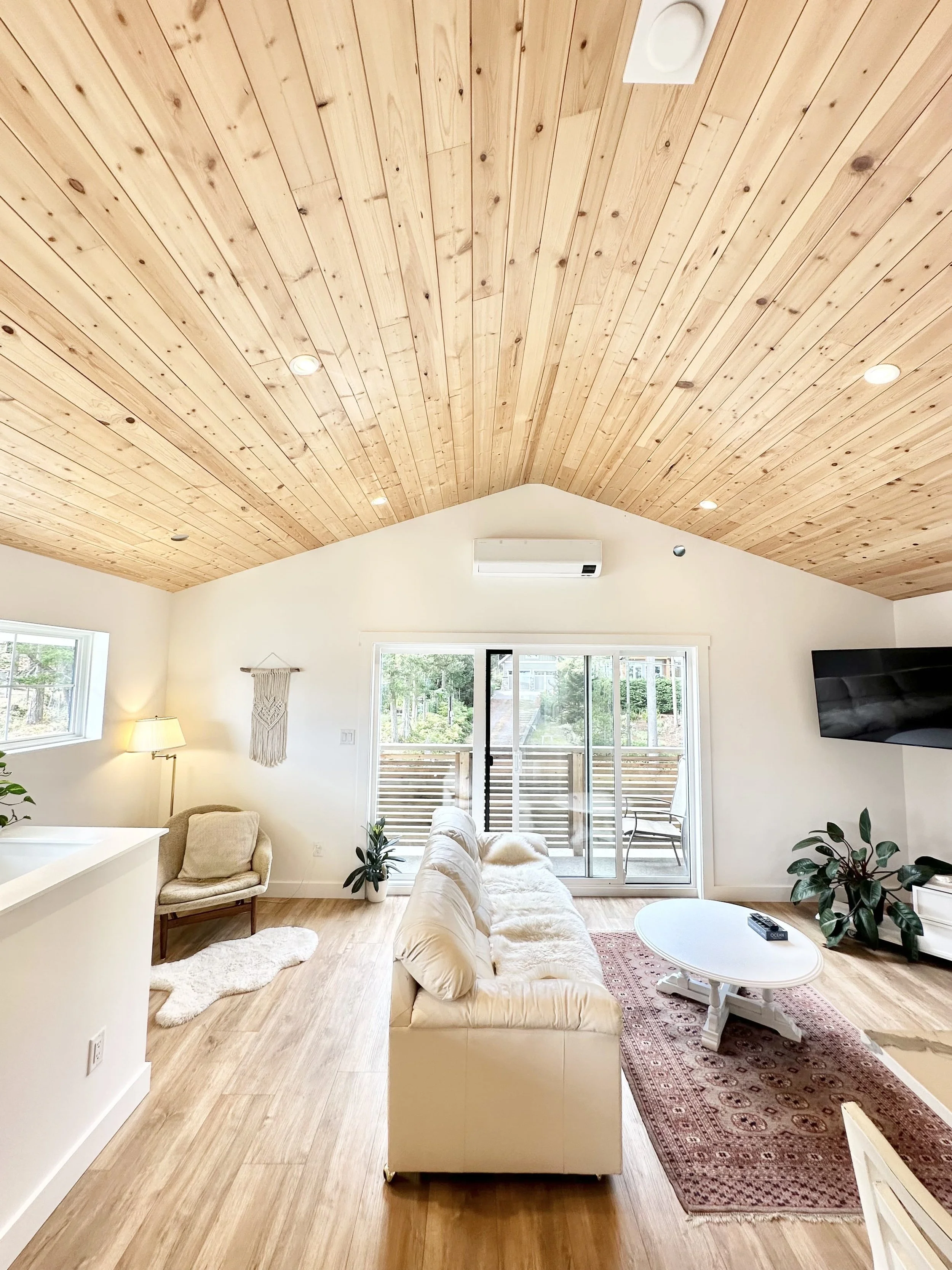 bright open airbnb living space with natural wood cieling