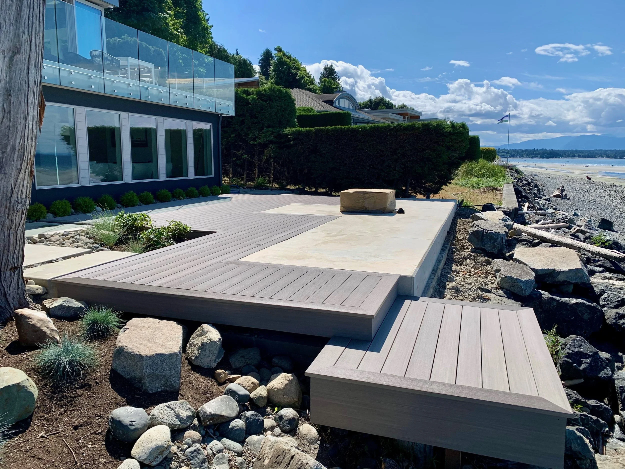 expansive waterfront deck and patio overlooking the beach
