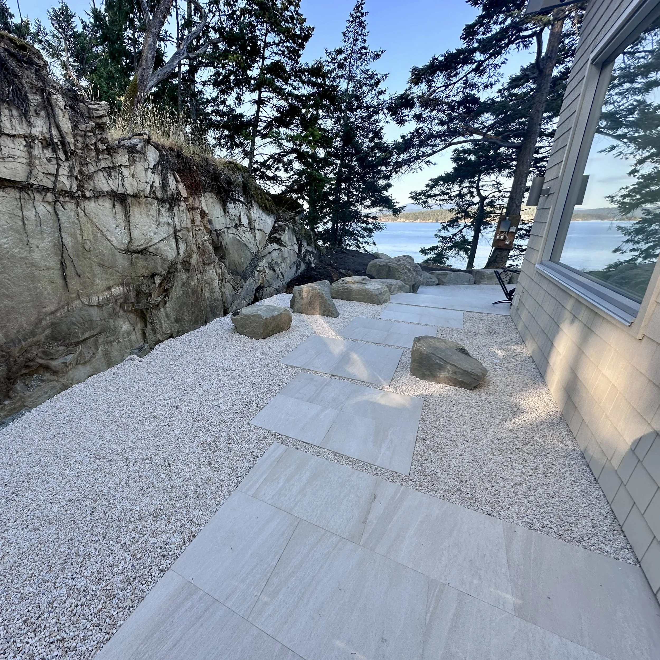 exterior rock path on the side of a house