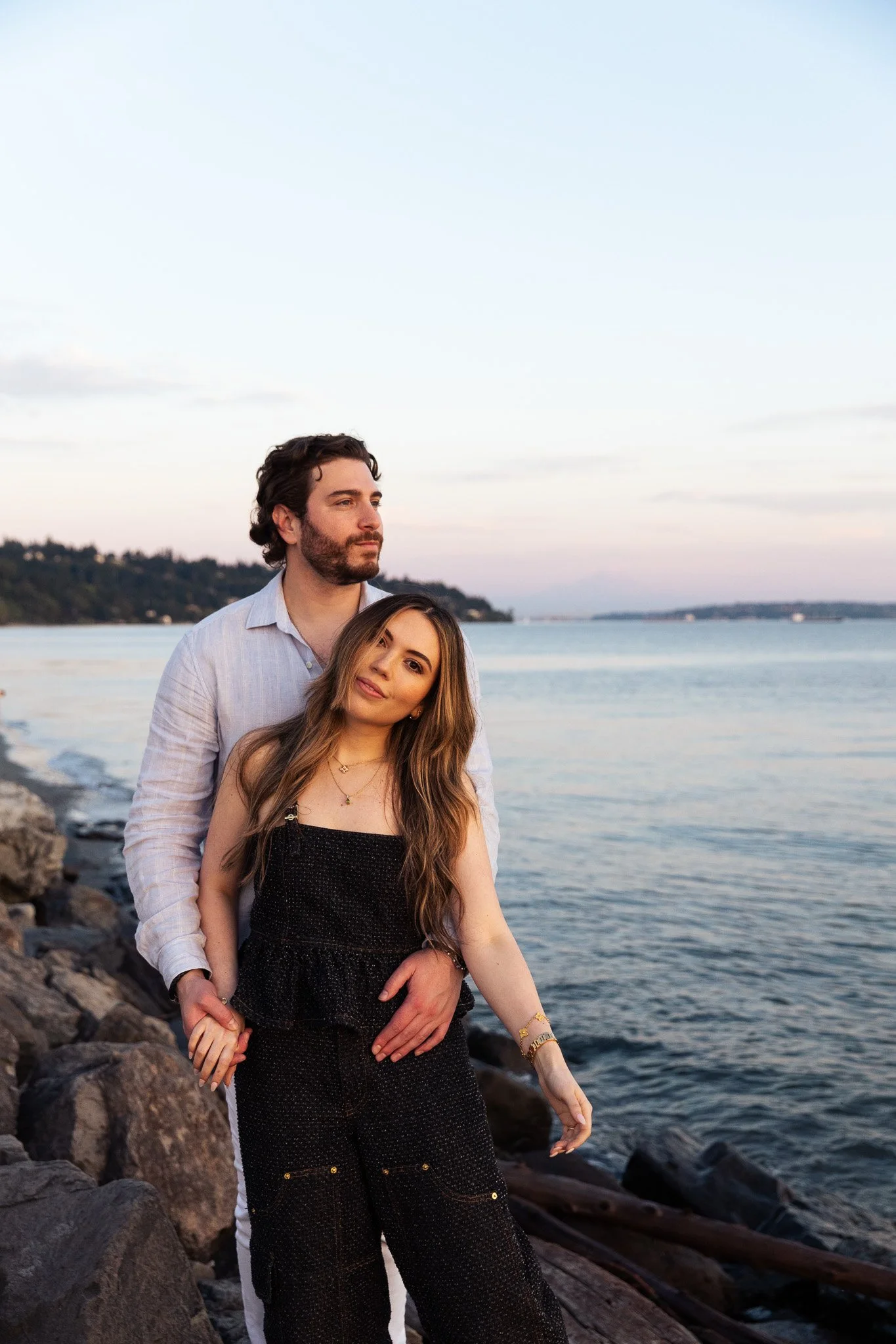 Couple during sunset engagement session at Discovery Park in Seattle