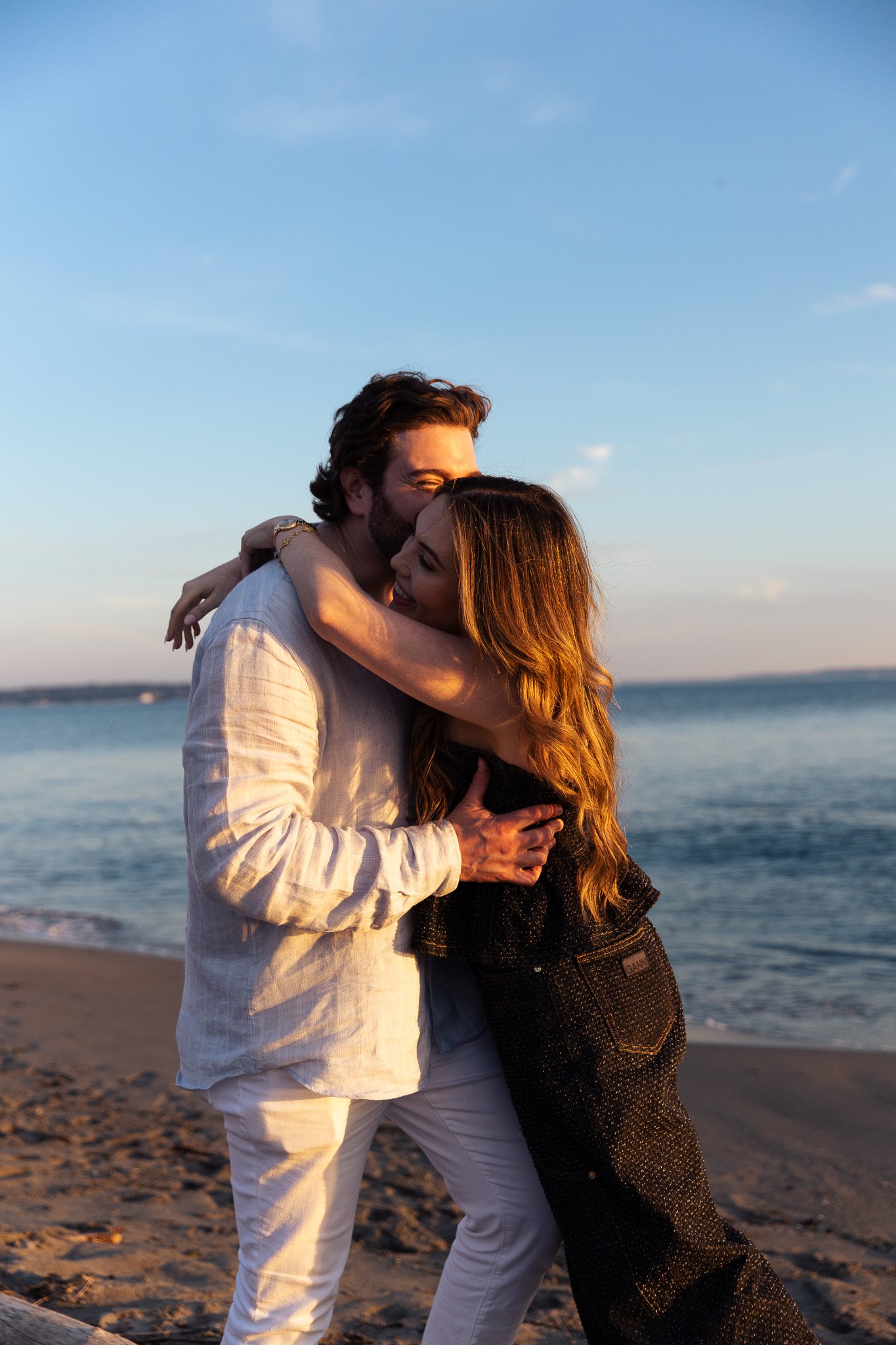 Couple during sunset engagement session at Discovery Park in Seattle