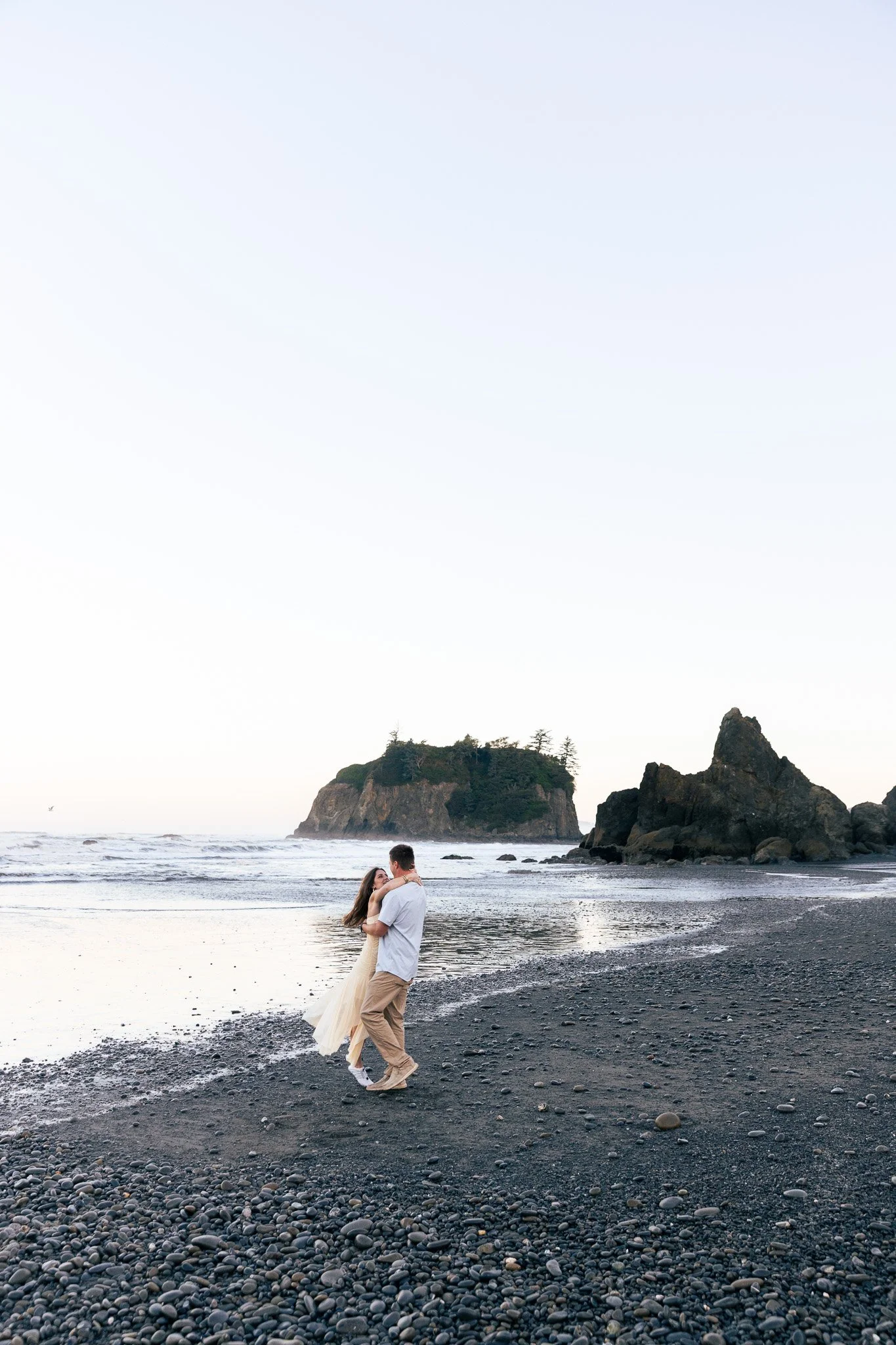 couple during sunrise engagement session at ruby beach, olympic peninsula
