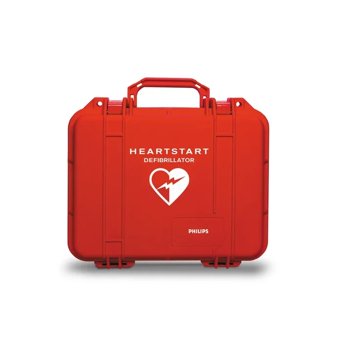 Red HeartStart defibrillator case with white heart and lightning bolt logo and Phillips brand label.