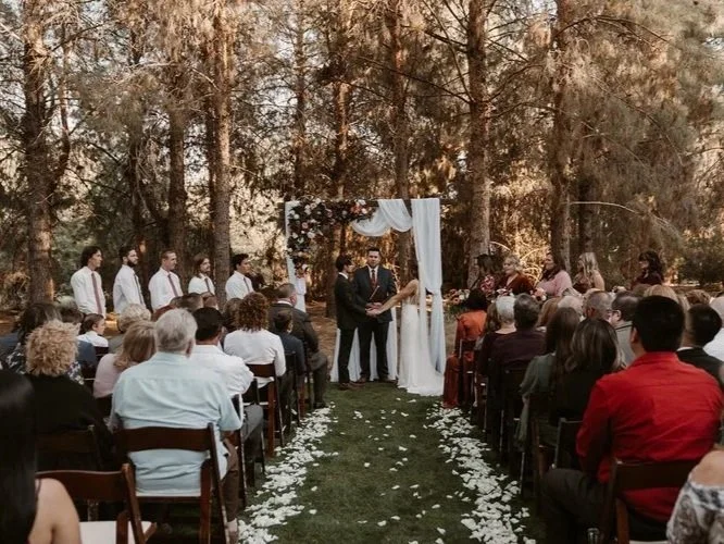 Outdoor pine ceremony setting at The Meadow at Schnepf Farms