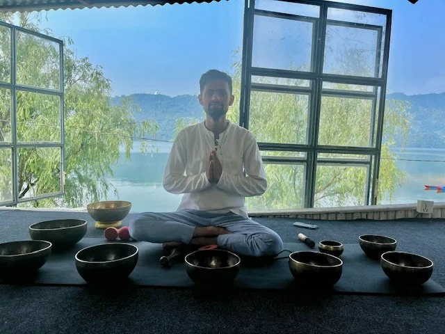 A man before a morning sound bath in Pokhara Nepal
