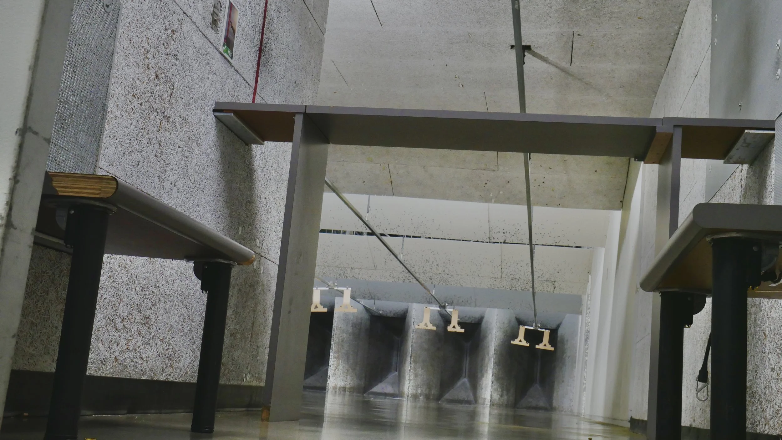 interior of a private booth with concrete floors at a high end shooting range in washington.