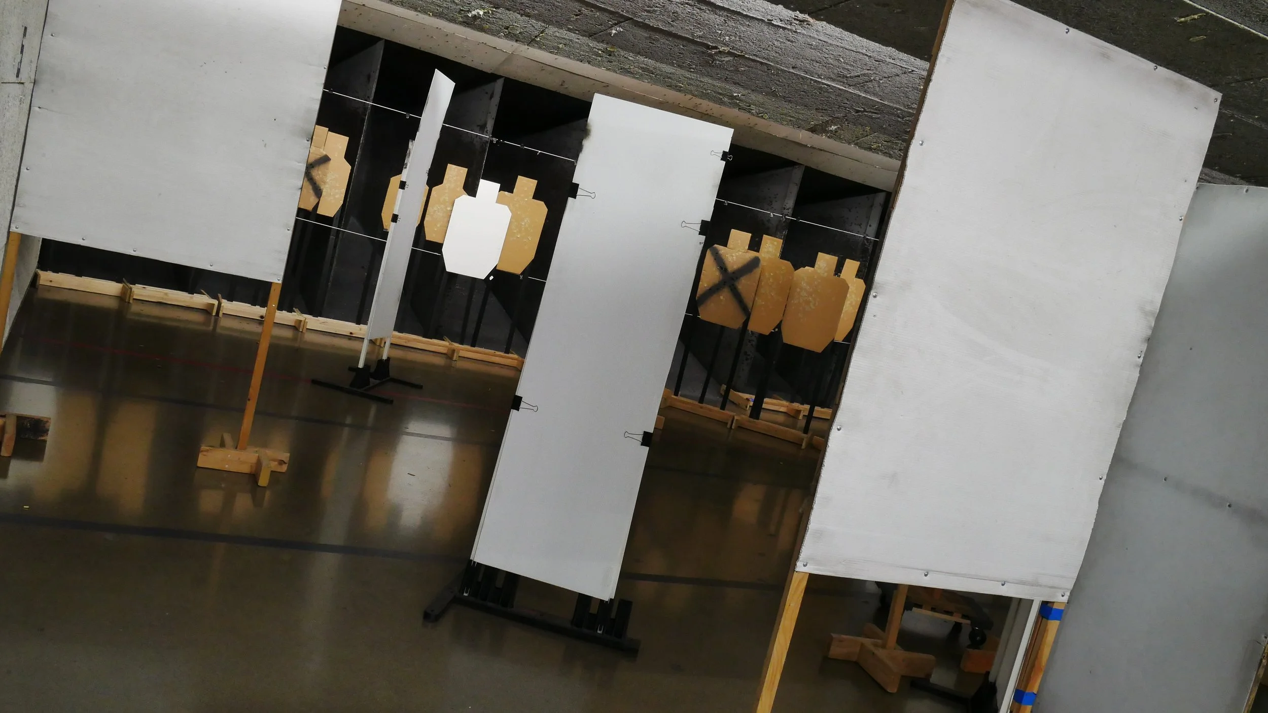 a shooting course set up with barricades and obstacles at an indoor shooting range in washington.