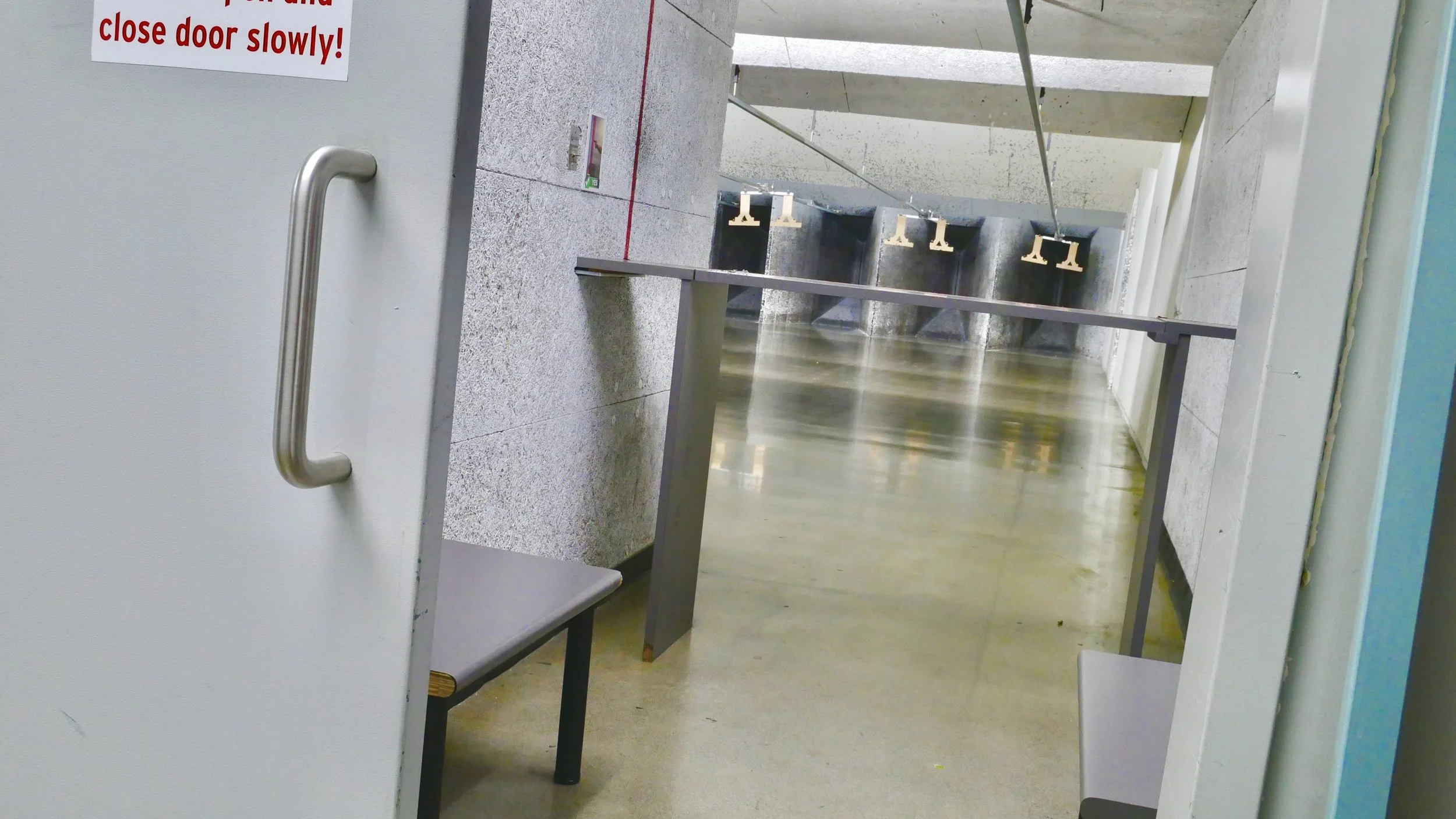 a private booth with concrete floors at a high end shooting range in washington.